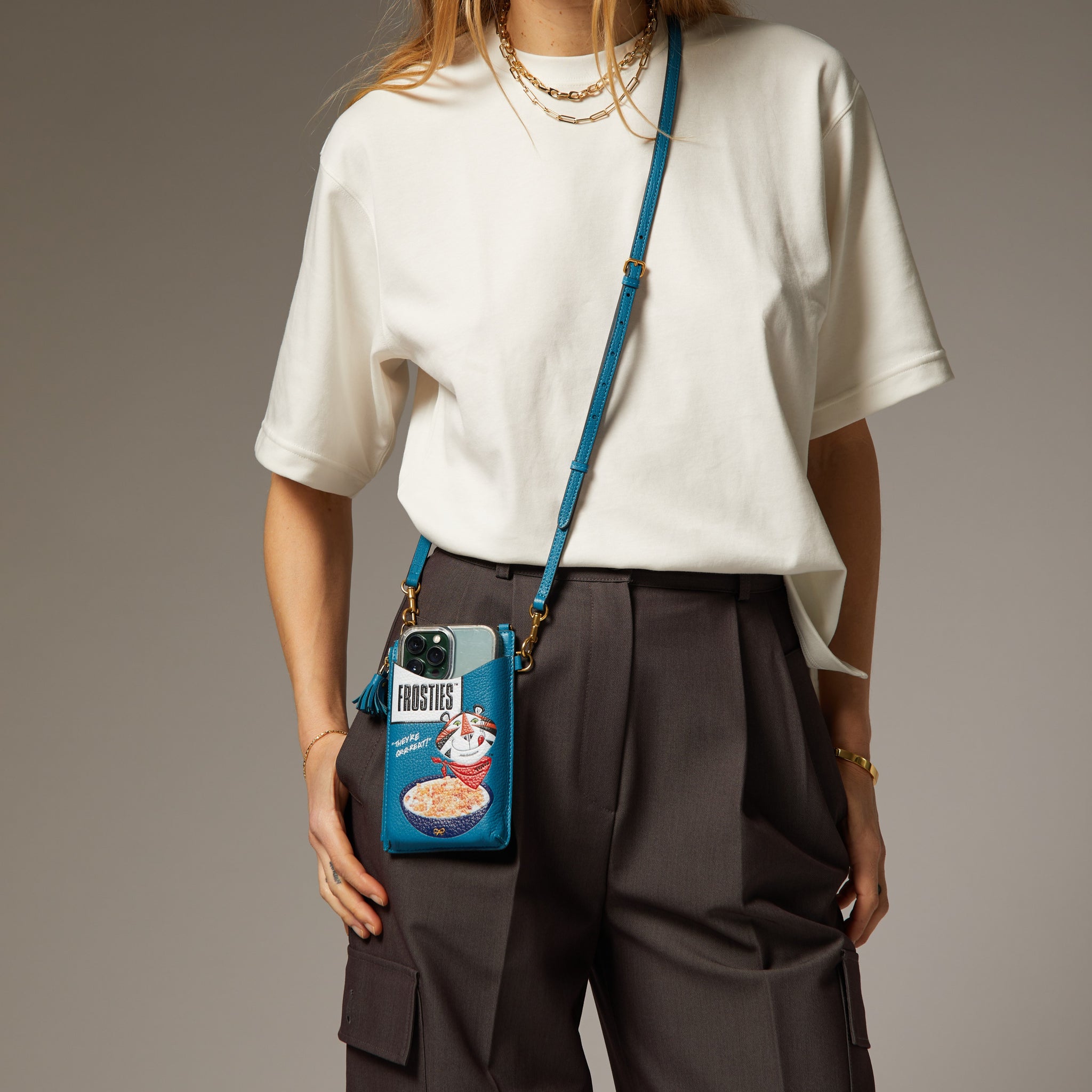 Anya Brands Frosties Zip Phone Pouch on Strap -

                  
                    Shiny Capra Leather in Light Petrol -
                  

                  Anya Hindmarch UK
