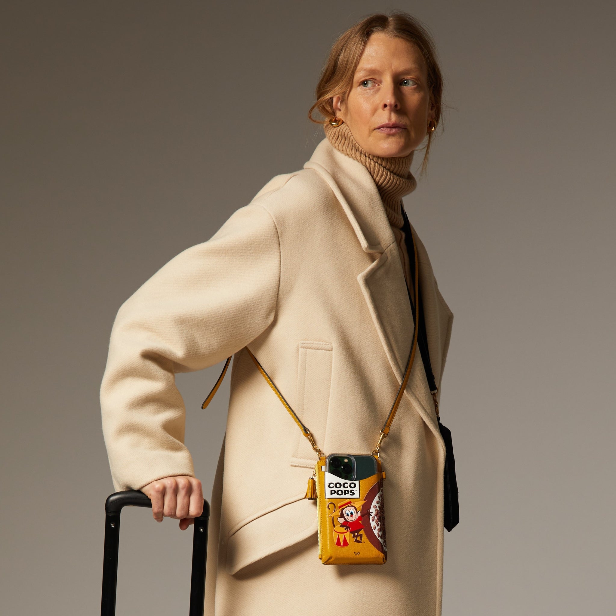 Anya Brands Coco Pops Zip Phone Pouch on Strap -

                  
                    Shiny Capra Leather in Mustard -
                  

                  Anya Hindmarch UK
