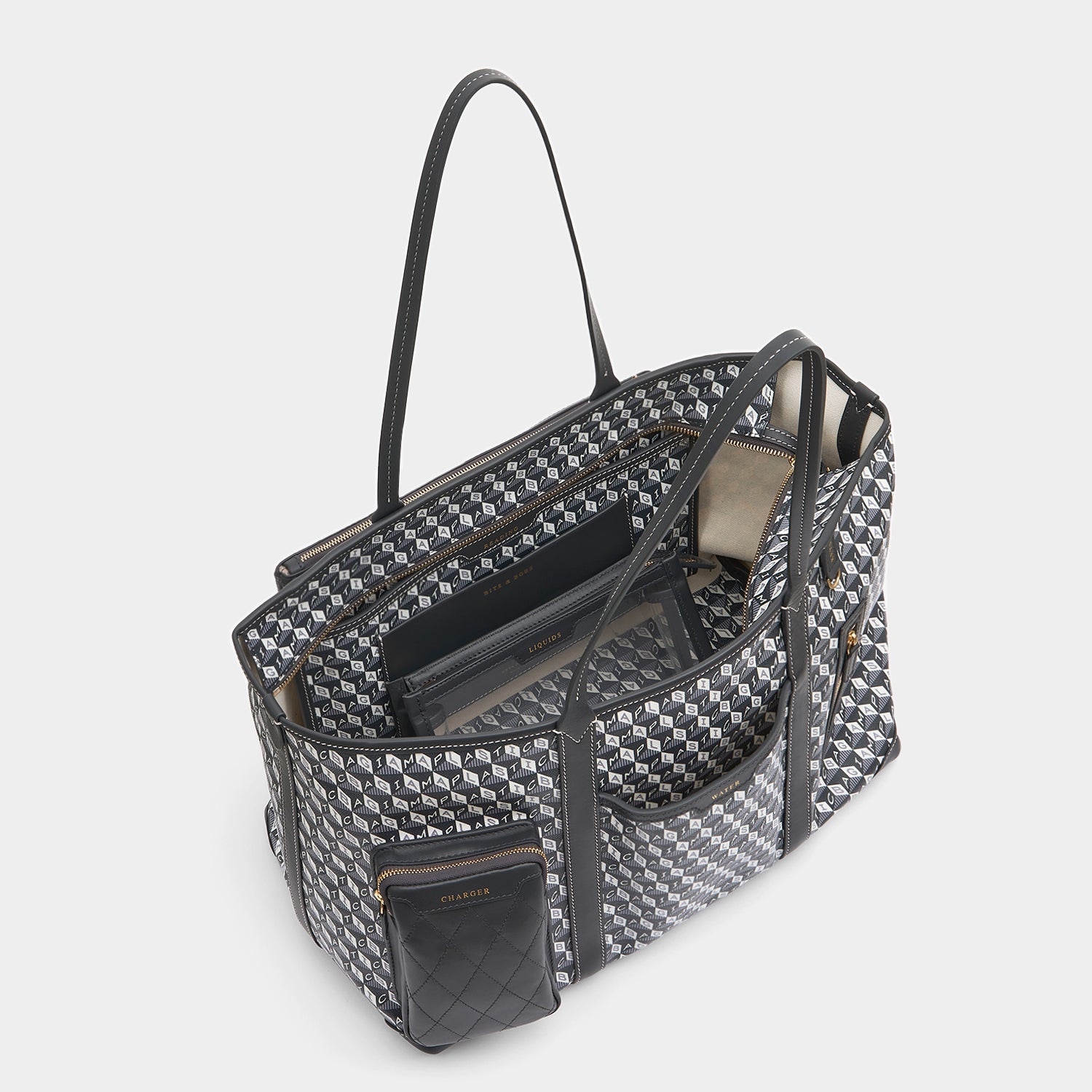 I am a Plastic Bag In-Flight Tote -

                  
                    Recycled Canvas in Charcoal -
                  

                  Anya Hindmarch UK
