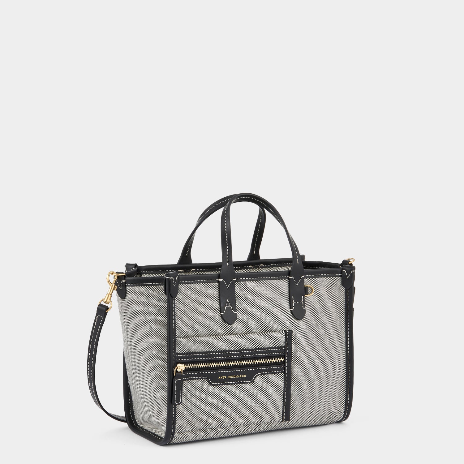Pocket XS Cross-body Tote -

                  
                    Mixed Canvas in Salt And Pepper -
                  

                  Anya Hindmarch UK
