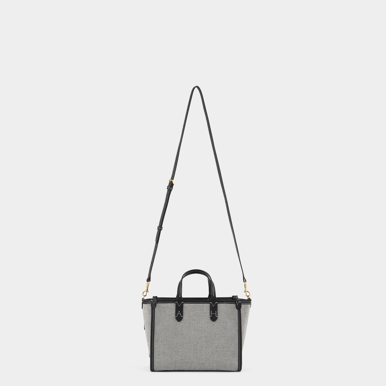 Pocket XS Cross-body Tote -

                  
                    Mixed Canvas in Salt And Pepper -
                  

                  Anya Hindmarch UK
