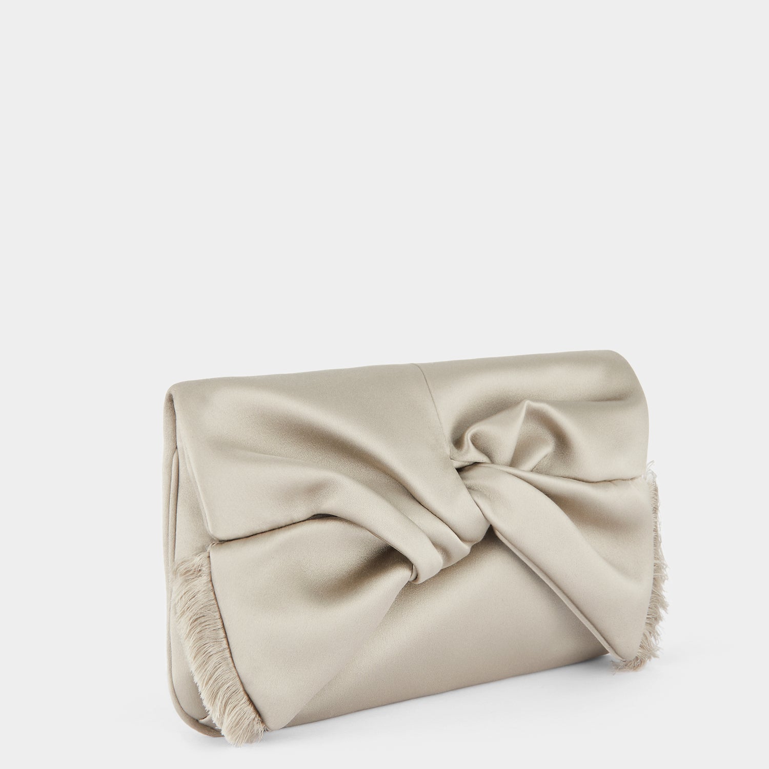 Bow Clutch -

                  
                    Satin in Silver -
                  

                  Anya Hindmarch UK
