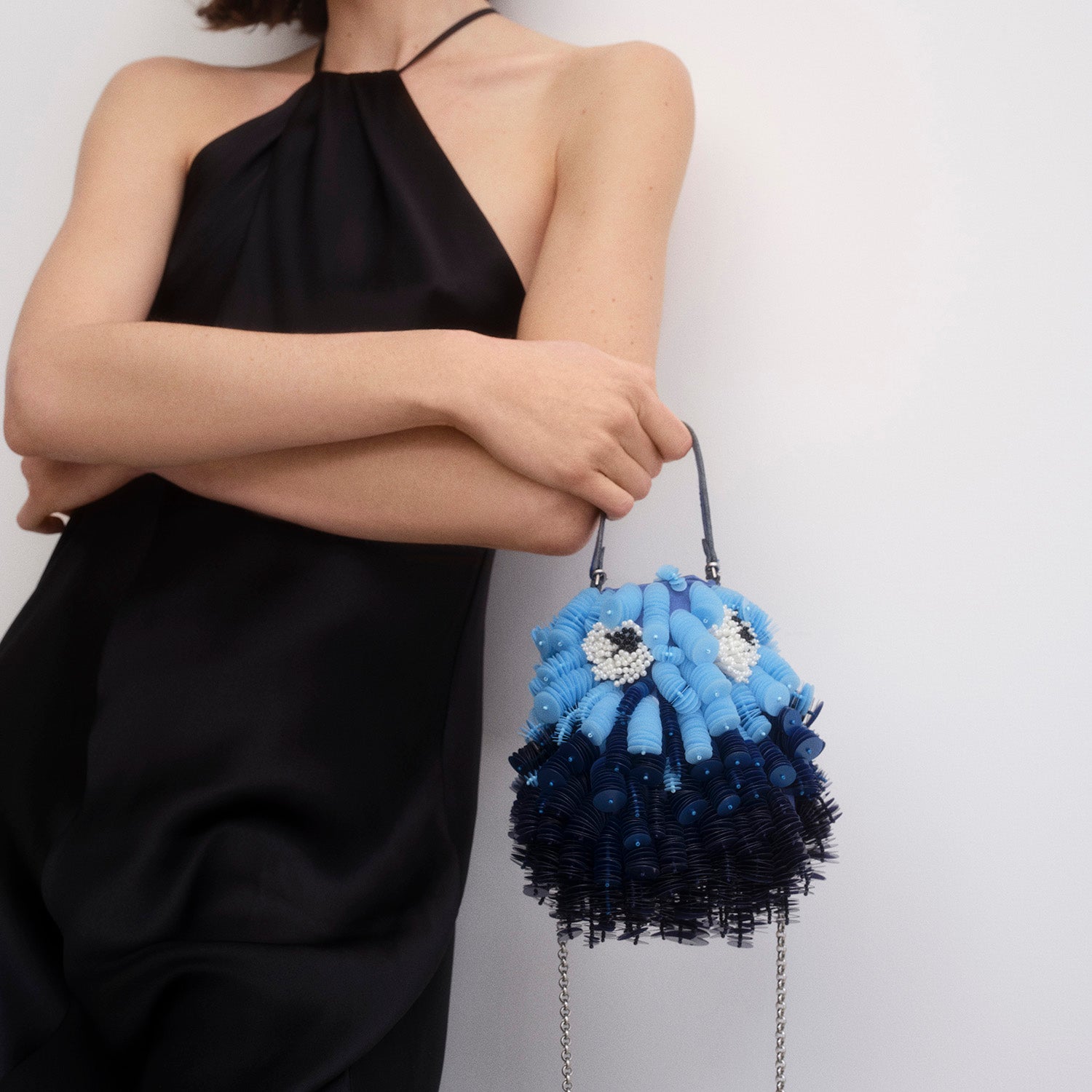 Blue beaded crossbody bag shaped like a fish by Anya Hindmarch