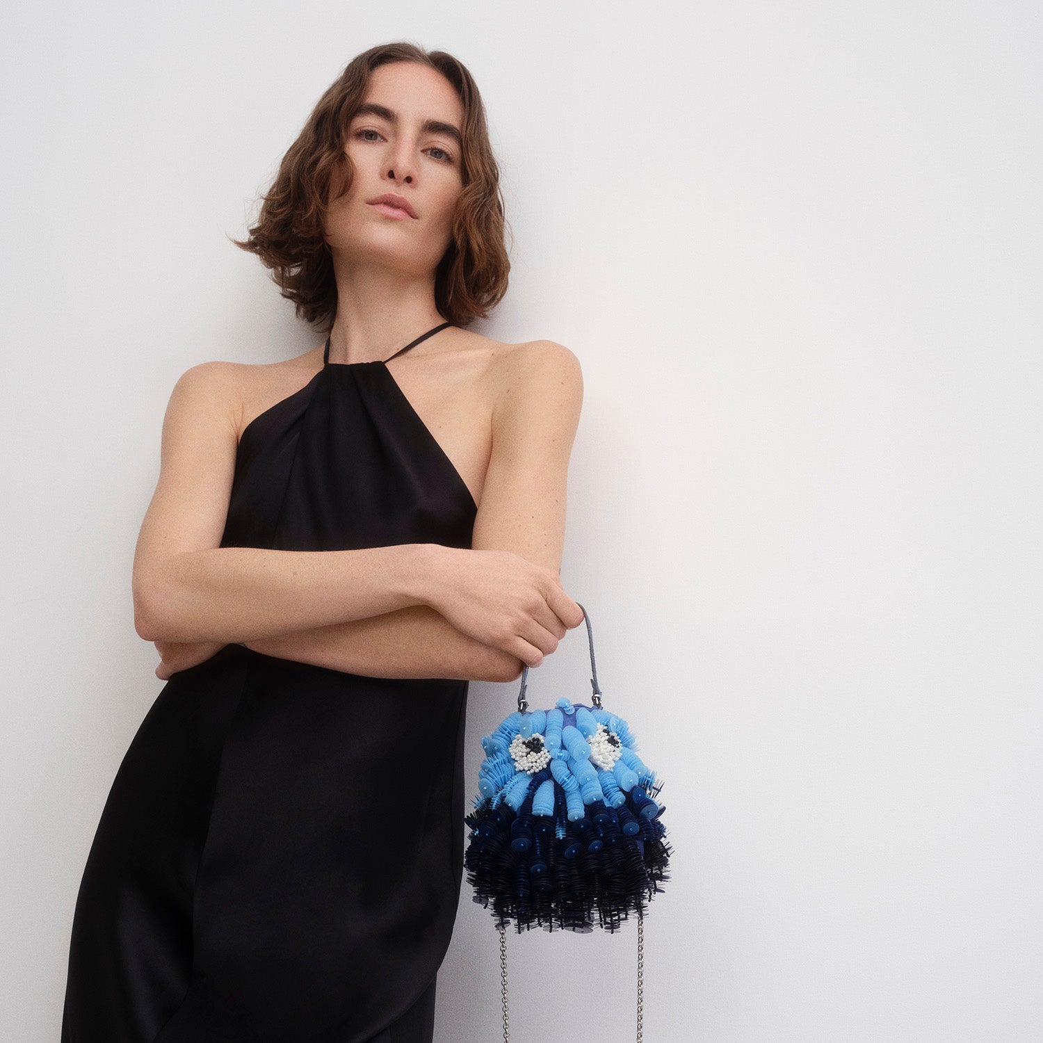 Blue beaded crossbody bag shaped like a fish by Anya Hindmarch