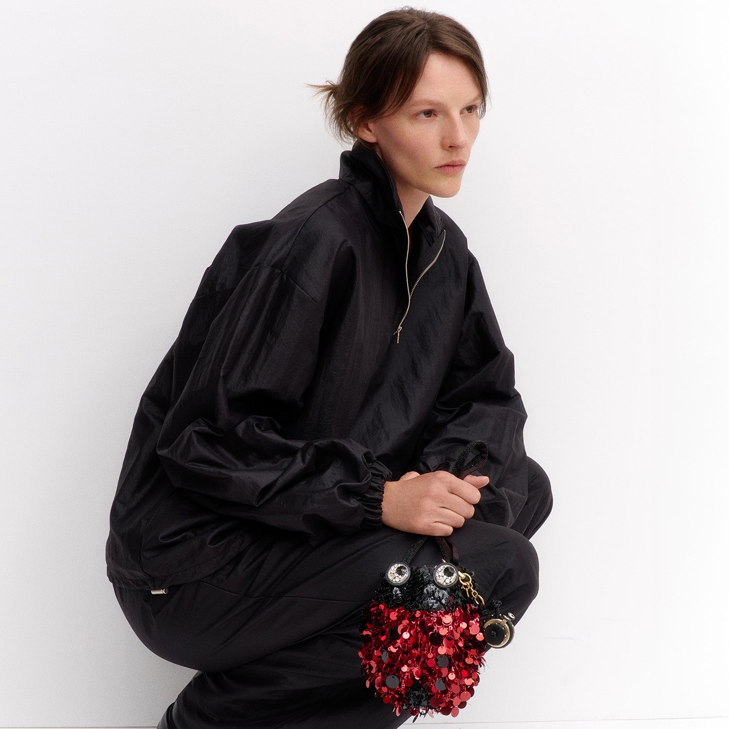 Ladybird Mini Bucket Bag -

          
            Sequins in black and red -
          

          Anya Hindmarch UK
