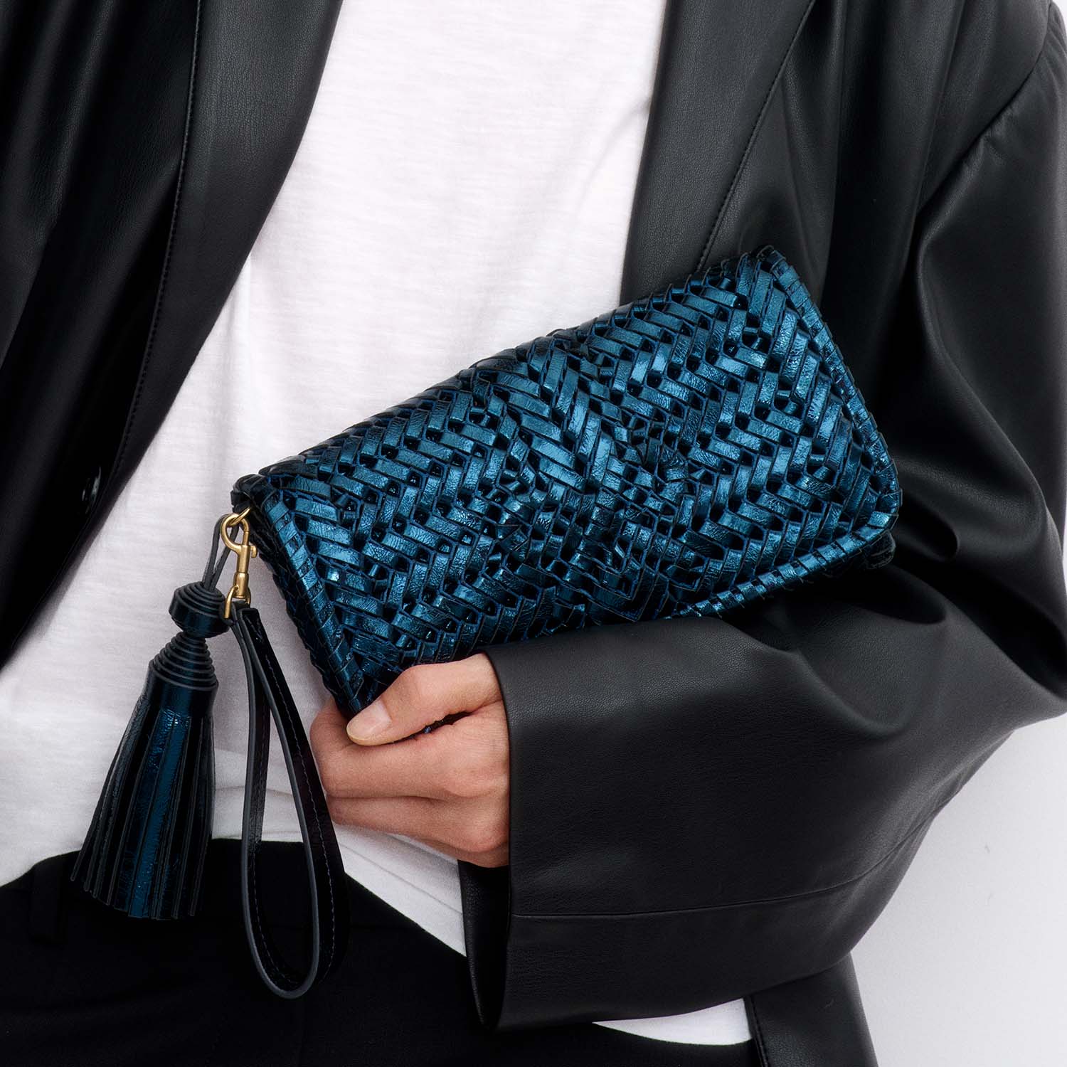 Neeson Tassel Clutch -

          
            Capra Leather in Metallic Blue -
          

          Anya Hindmarch UK
