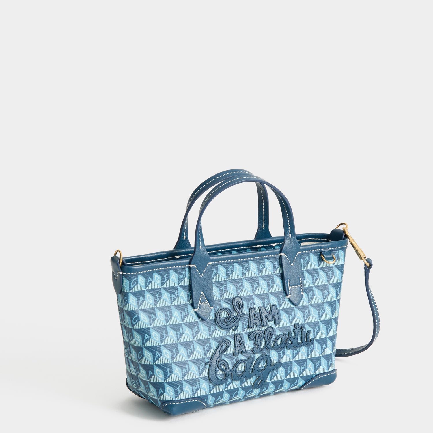 I Am A Plastic Bag Mini Tote -

          
            Recycled canvas/Satin leather in Petrol Blue -
          

          Anya Hindmarch UK
