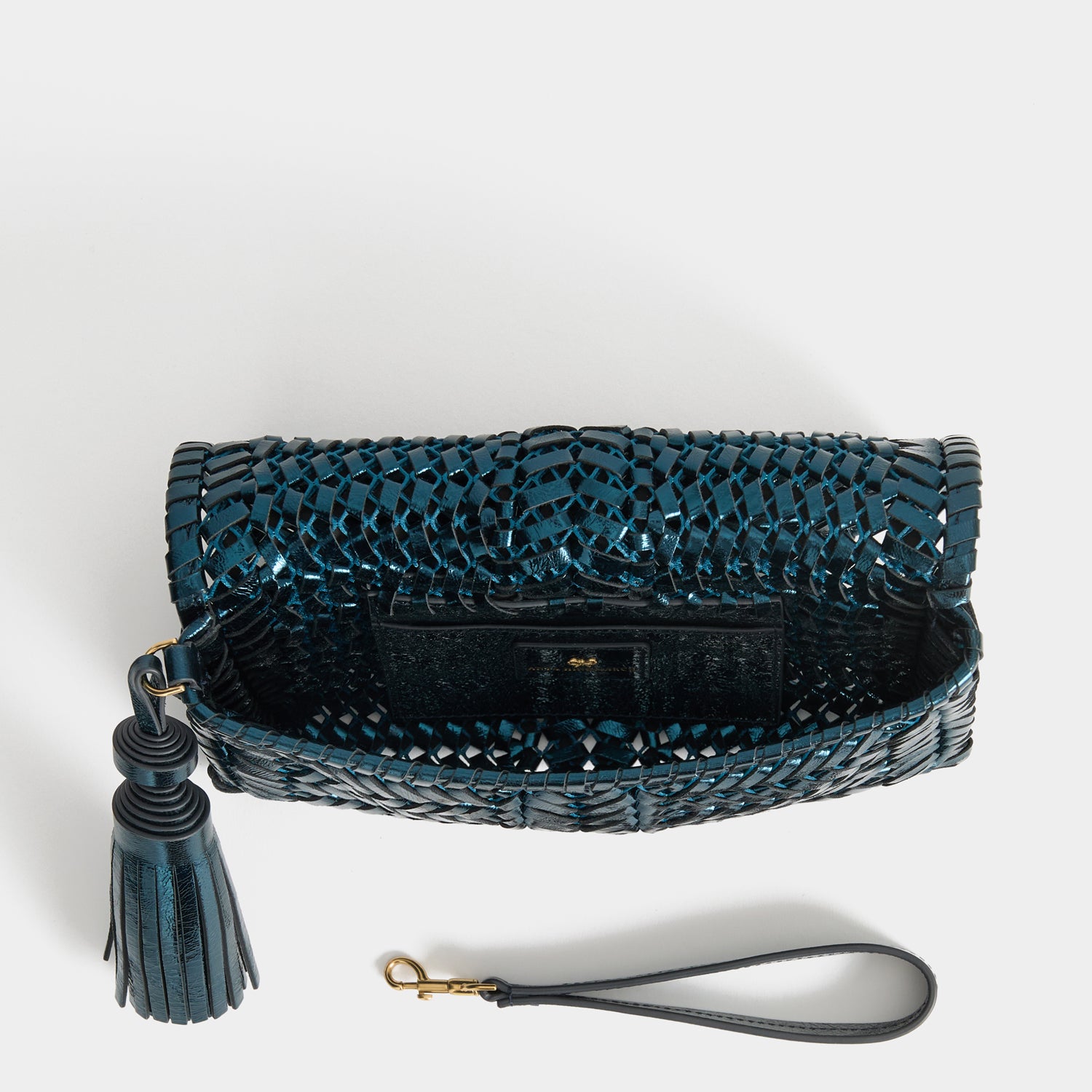 Neeson Tassel Clutch -

          
            Capra Leather in Metallic Blue -
          

          Anya Hindmarch UK
