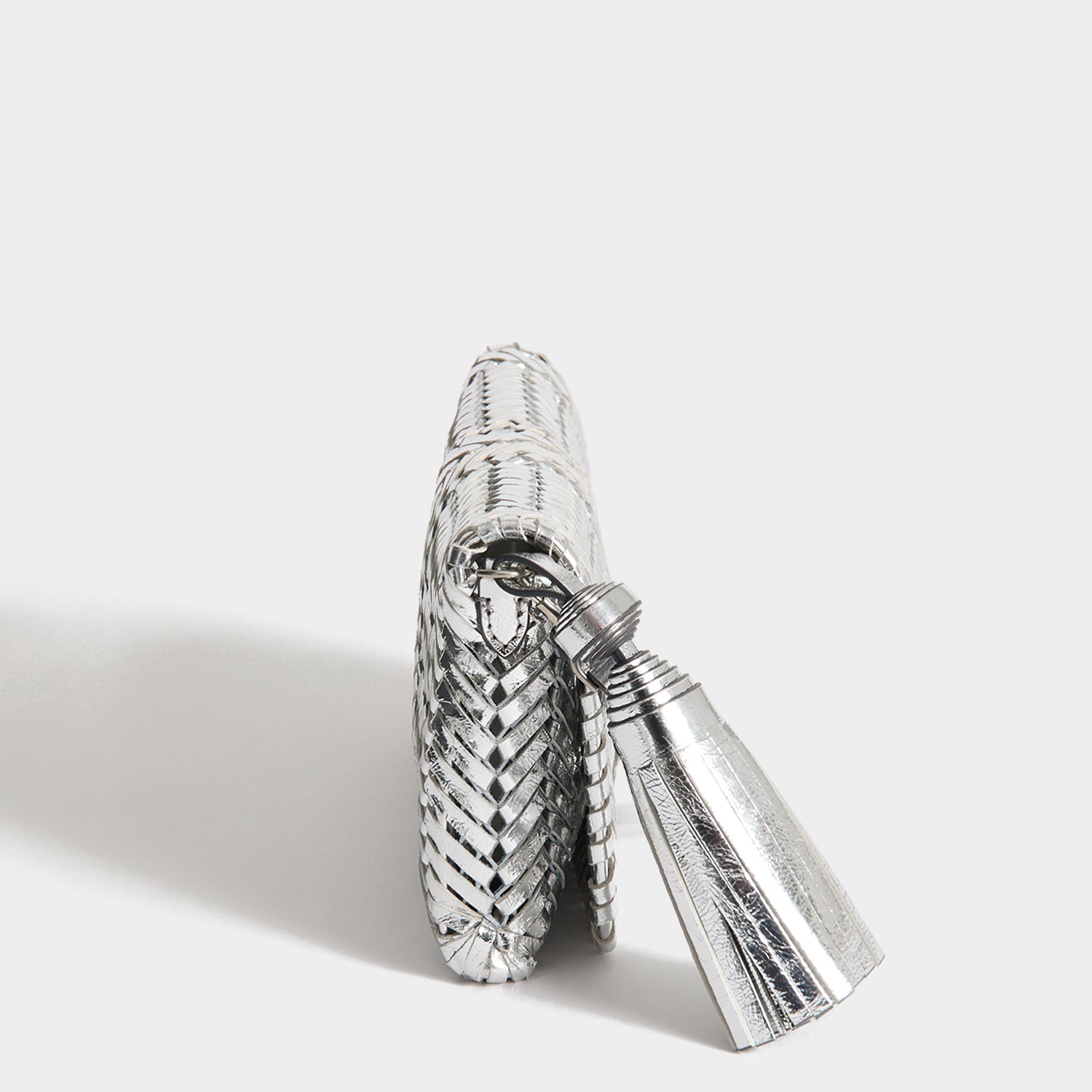 Neeson Tassel Clutch -

          
            Capra Leather in Silver -
          

          Anya Hindmarch UK
