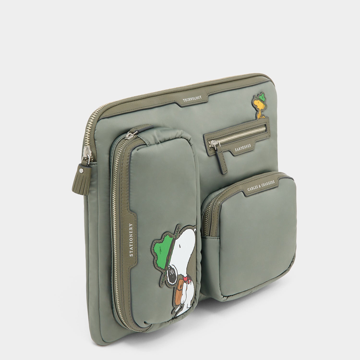 Peanuts Snoopy Tech Case -

          
            Recycled padded fabric in Fern Green -
          

          Anya Hindmarch UK
