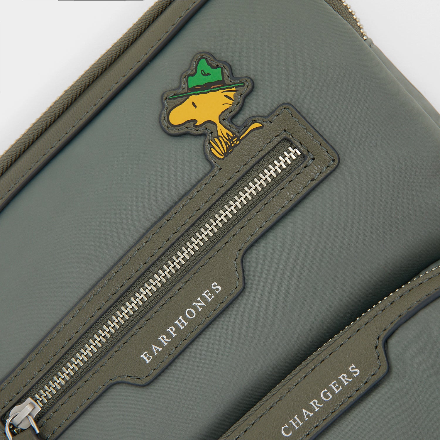 Peanuts Snoopy Tech Case -

          
            Recycled padded fabric in Fern Green -
          

          Anya Hindmarch UK
