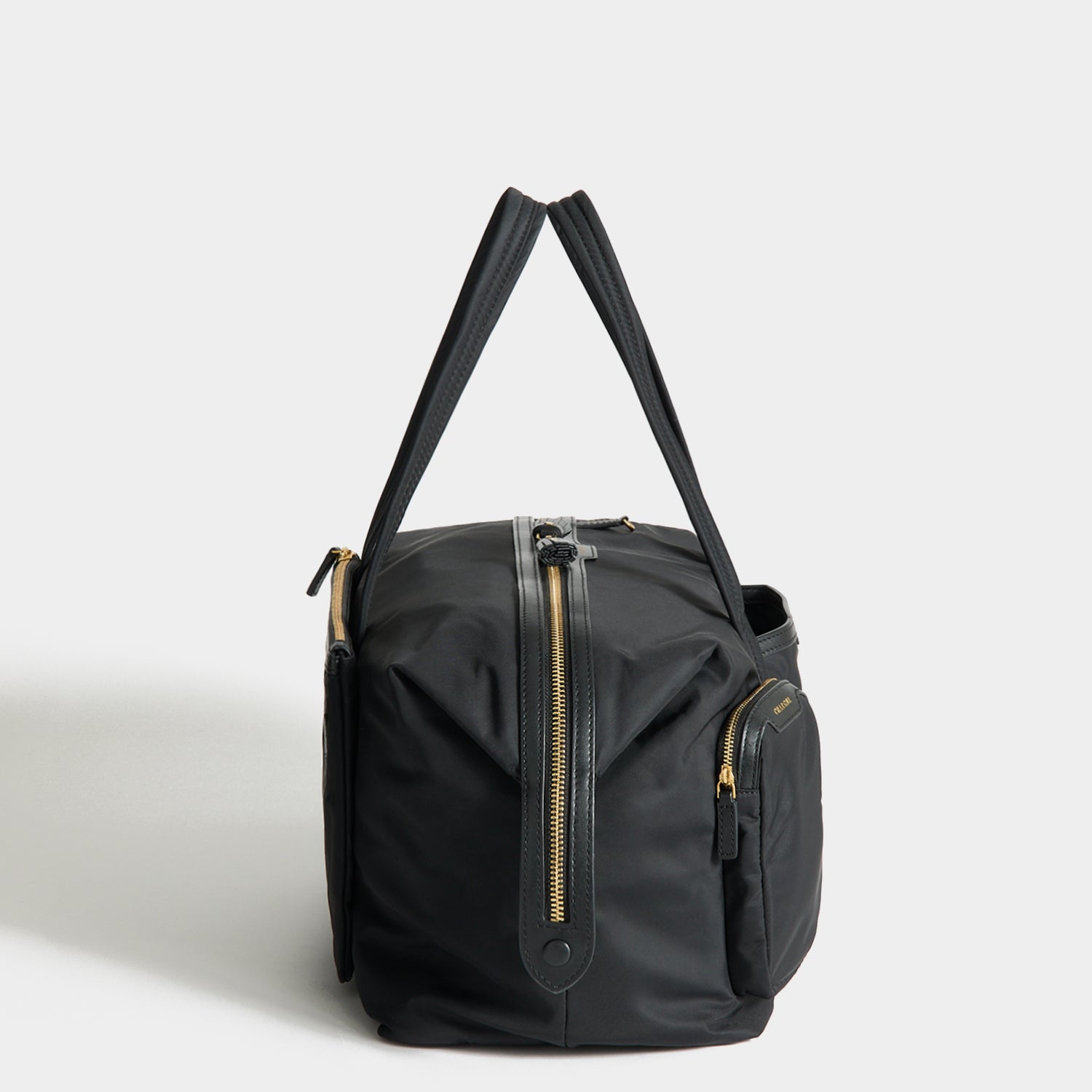 In-Flight Travel Bag -

          
            Regenerated Econyl® in Black -
          

          Anya Hindmarch UK
