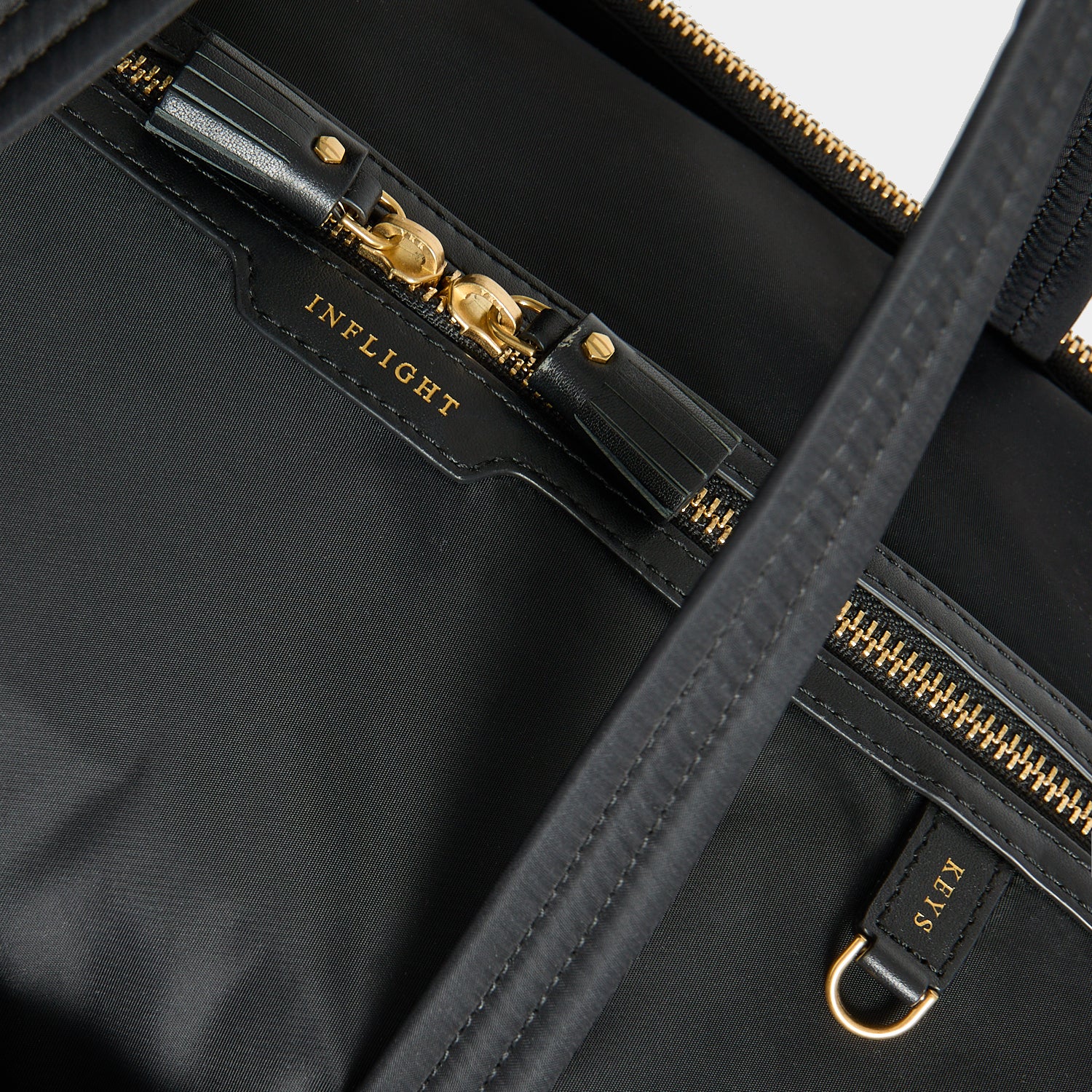 In-Flight Travel Bag -

          
            Regenerated Econyl® in Black -
          

          Anya Hindmarch UK
