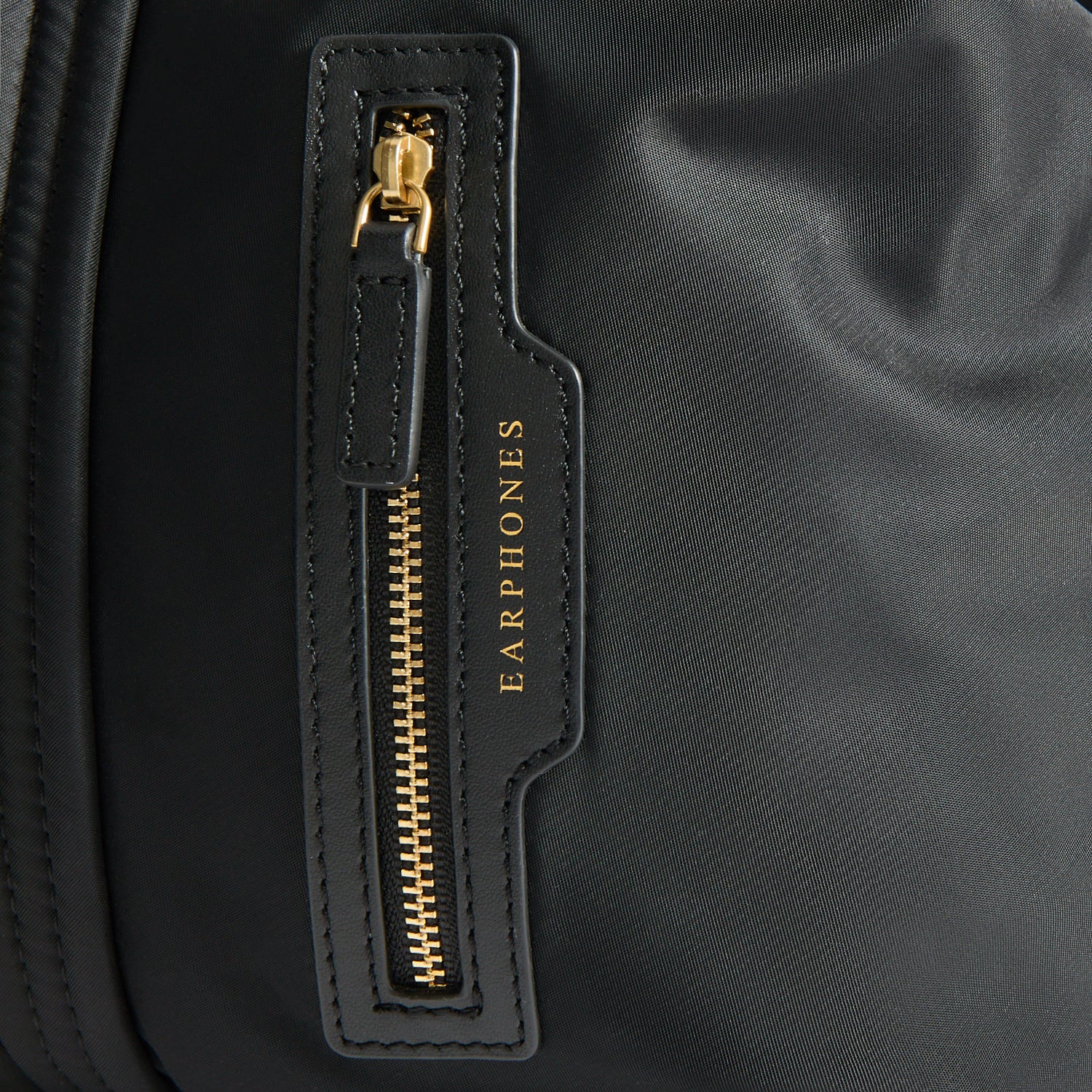 In-Flight Travel Bag -

          
            Regenerated Econyl® in Black -
          

          Anya Hindmarch UK
