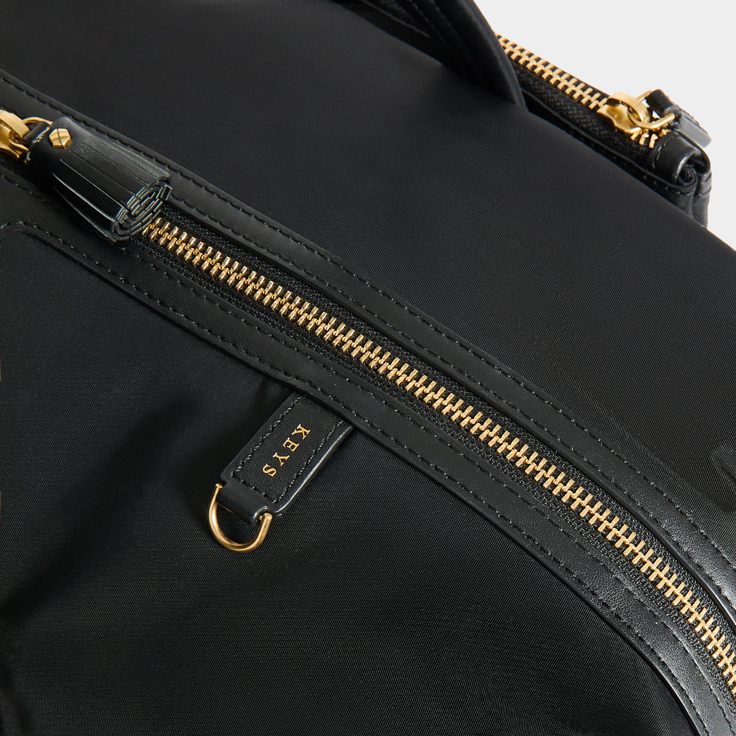 In-Flight Travel Bag -

          
            Regenerated Econyl® in Black -
          

          Anya Hindmarch UK

