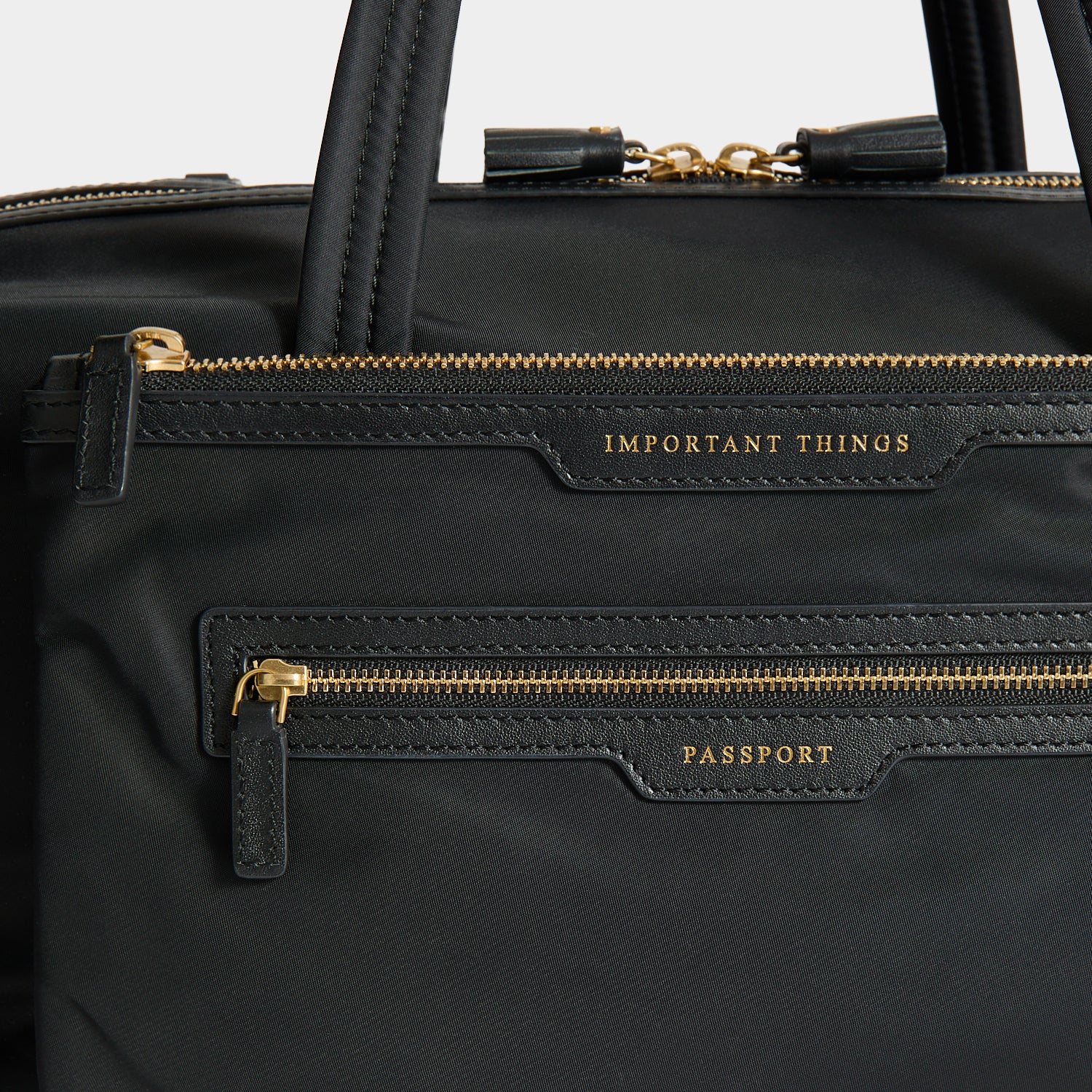 In-Flight Travel Bag -

          
            Regenerated Econyl® in Black -
          

          Anya Hindmarch UK
