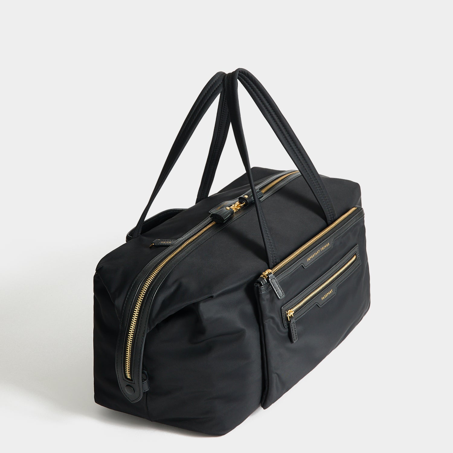 In-Flight Travel Bag -

          
            Regenerated Econyl® in Black -
          

          Anya Hindmarch UK
