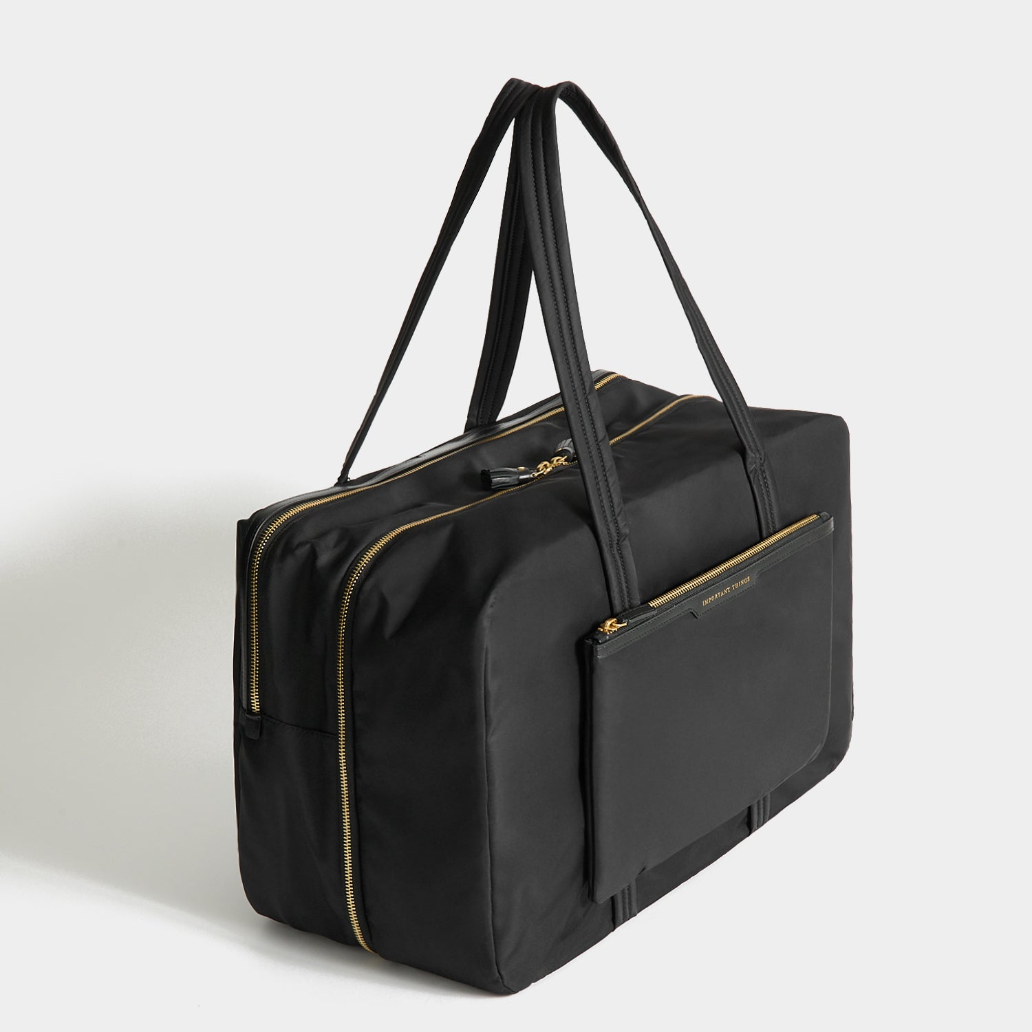24 Hour Travel Bag -

          
            Regenerated ECONYL® in Black -
          

          Anya Hindmarch UK

