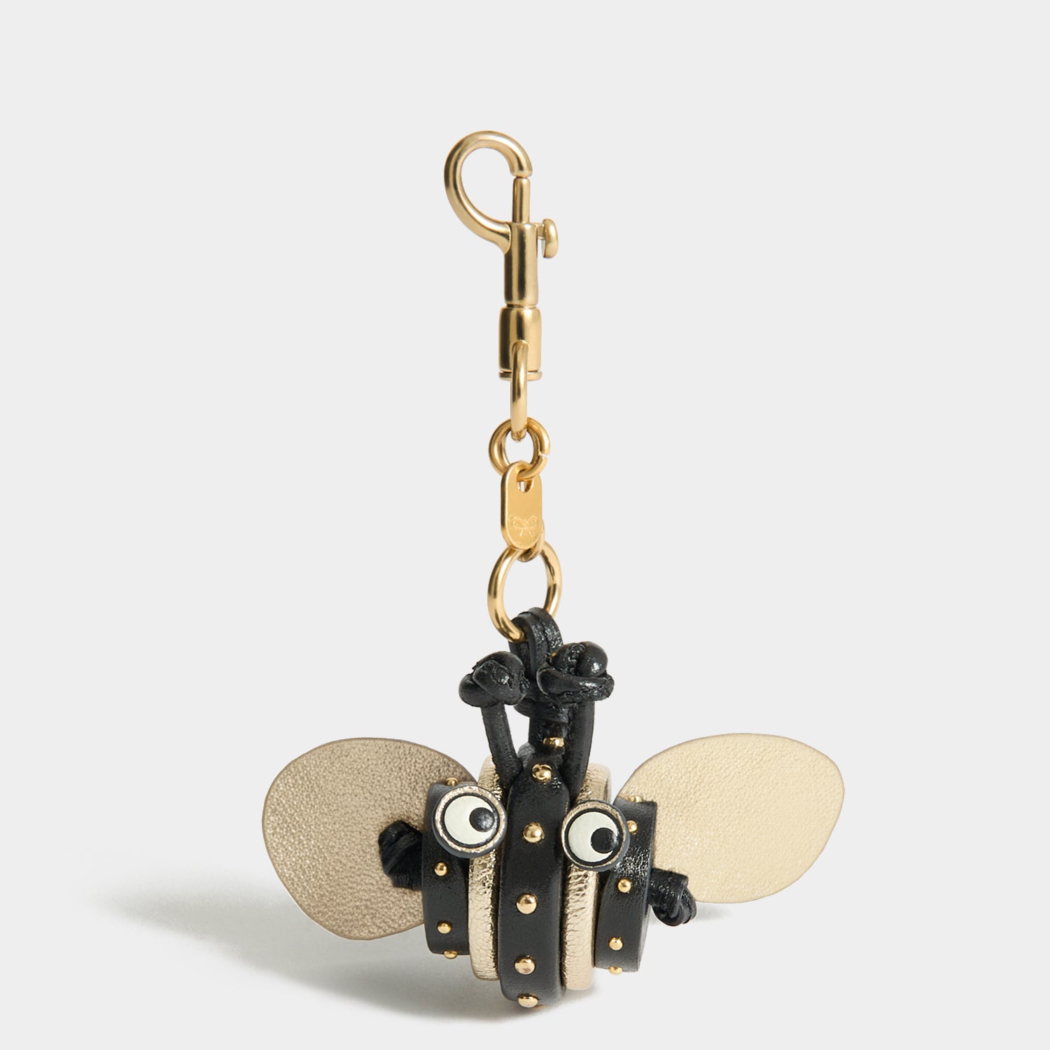 Bee Charm -

          
            Capra Leather in black -
          

          Anya Hindmarch UK
