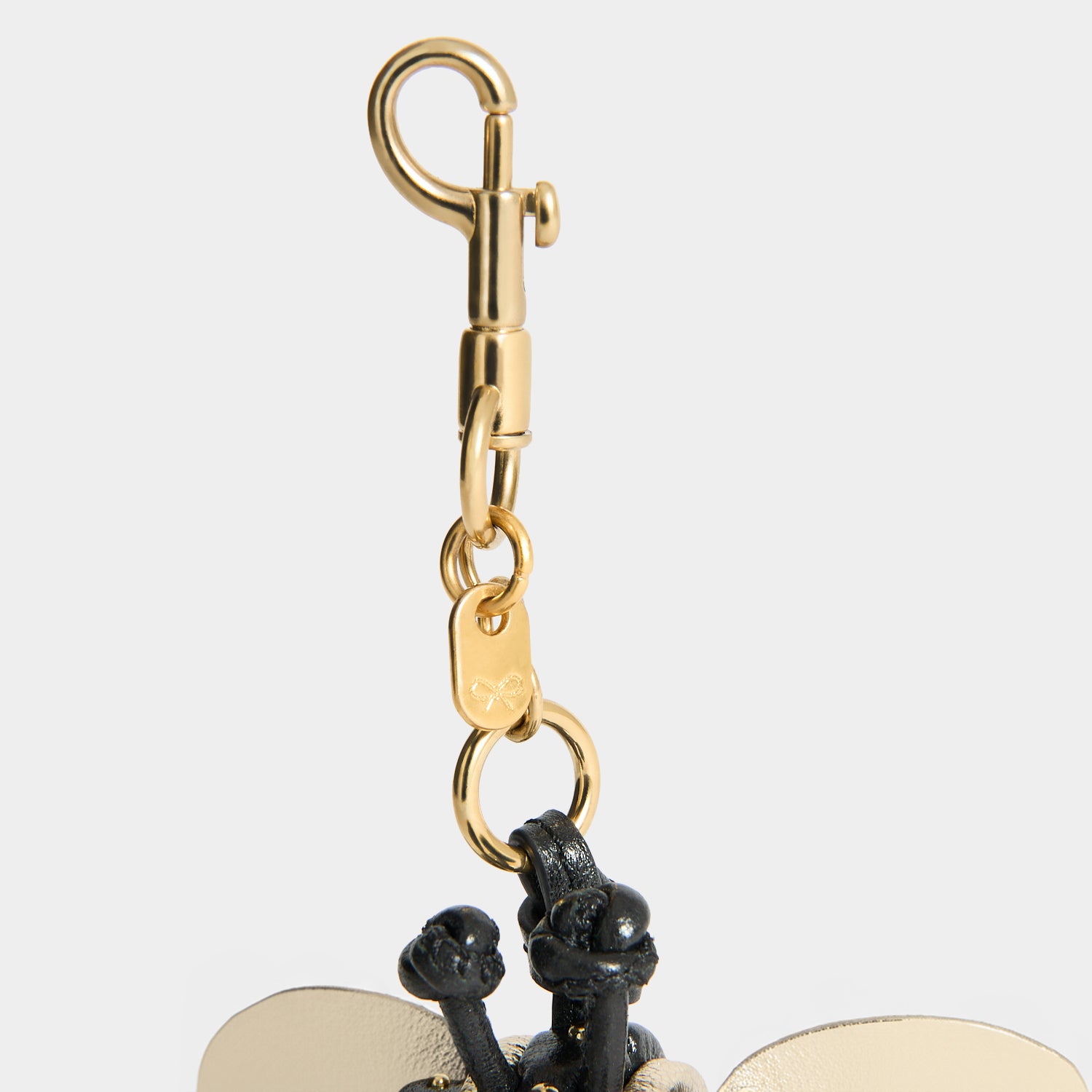 Bee Charm -

          
            Capra Leather in black -
          

          Anya Hindmarch UK
