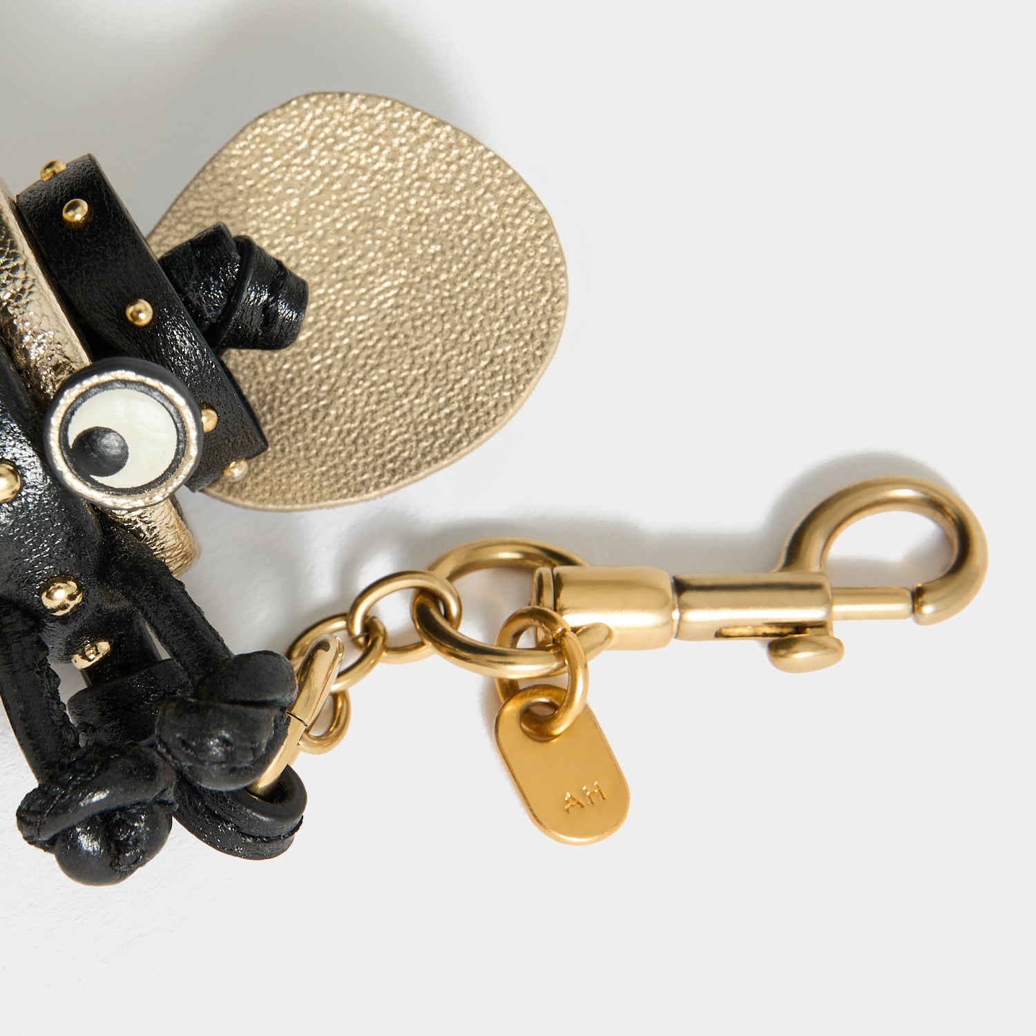 Bee Charm -

          
            Capra Leather in black -
          

          Anya Hindmarch UK
