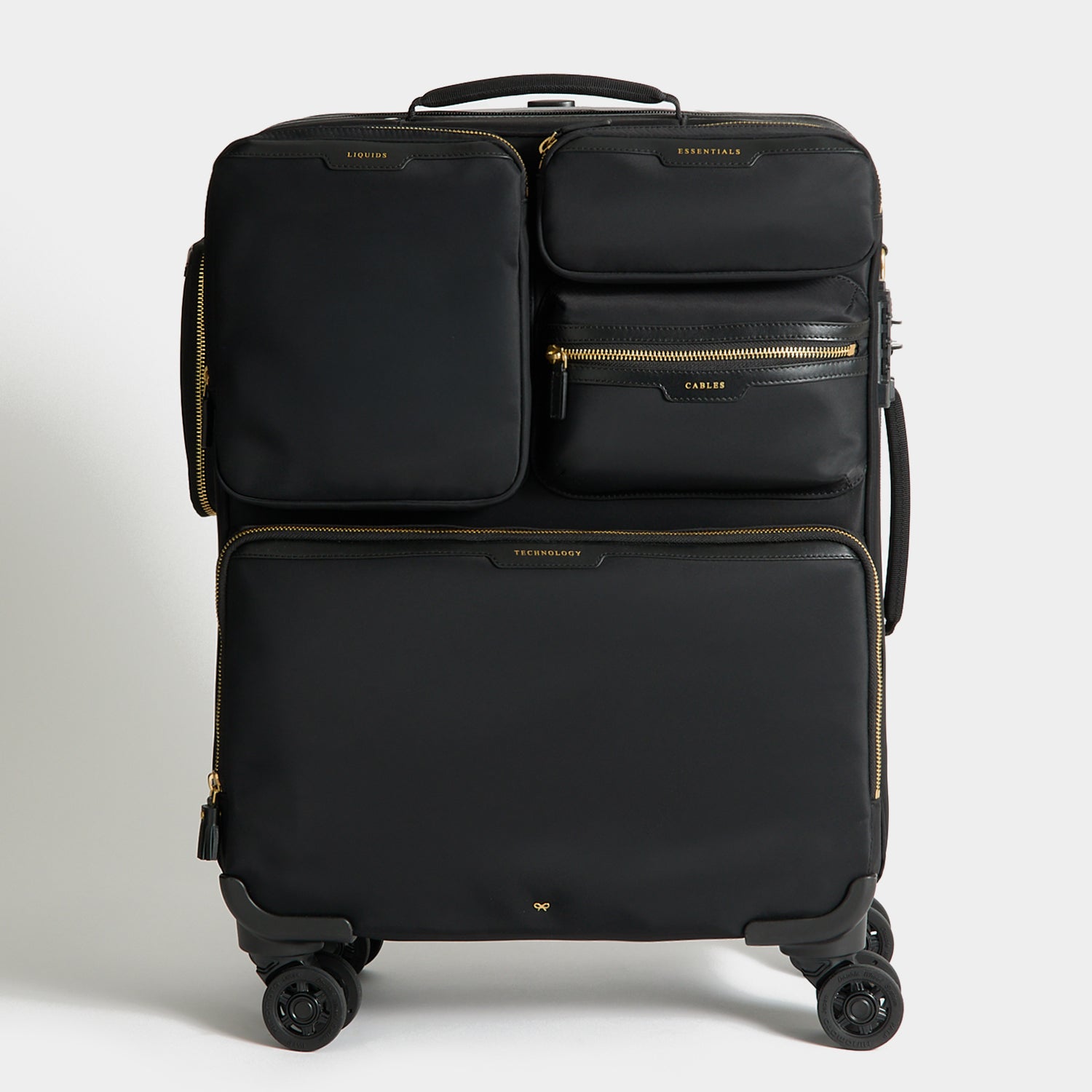 Short-Haul Suitcase -

          
            Econyl® Regenerated Nylon in Black -
          

          Anya Hindmarch UK

