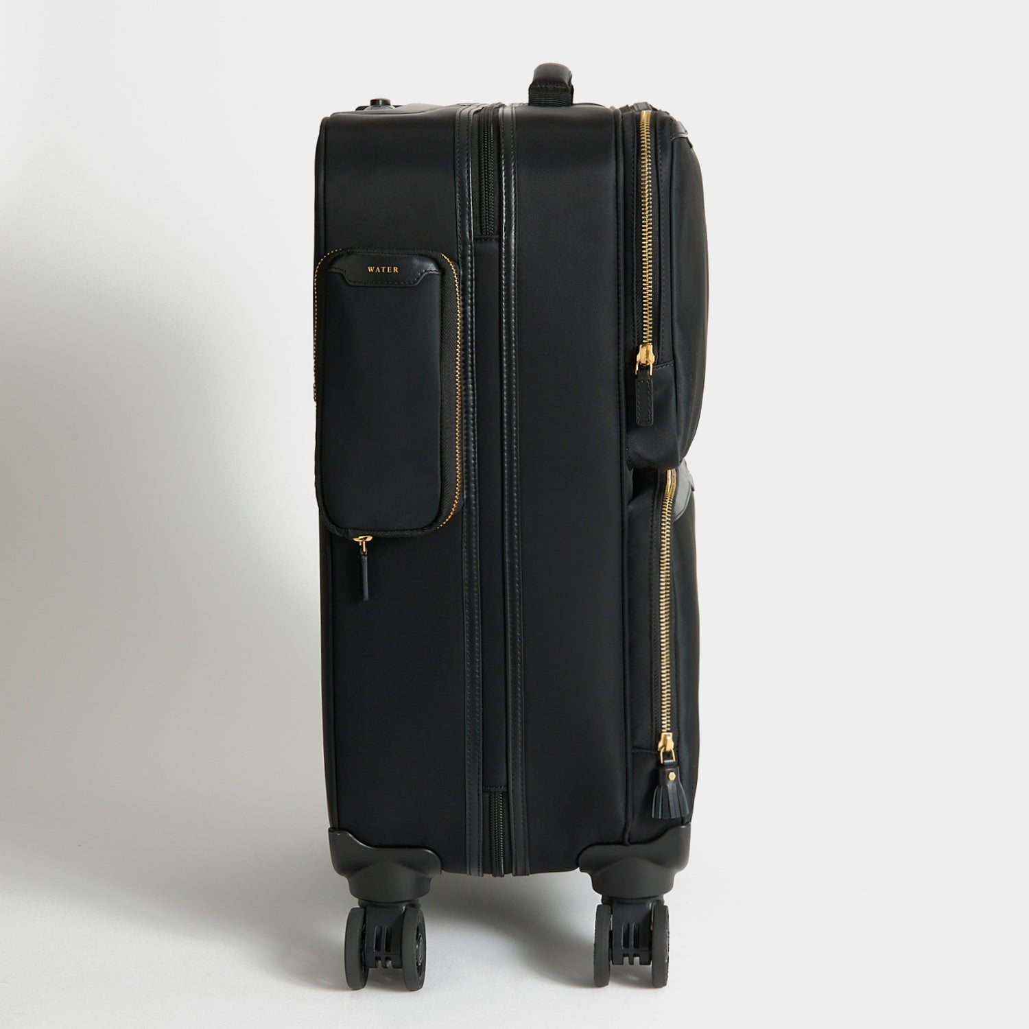 Short-Haul Suitcase -

          
            Econyl® Regenerated Nylon in Black -
          

          Anya Hindmarch UK
