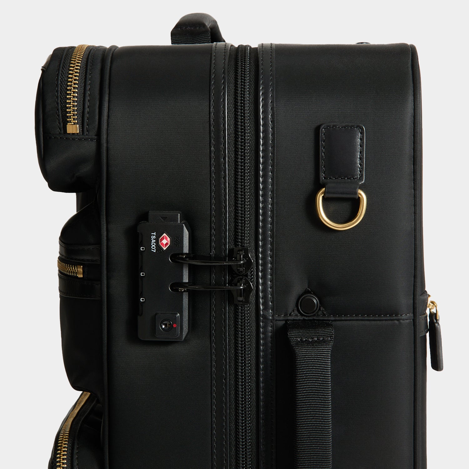 Short-Haul Suitcase -

          
            Econyl® Regenerated Nylon in Black -
          

          Anya Hindmarch UK

