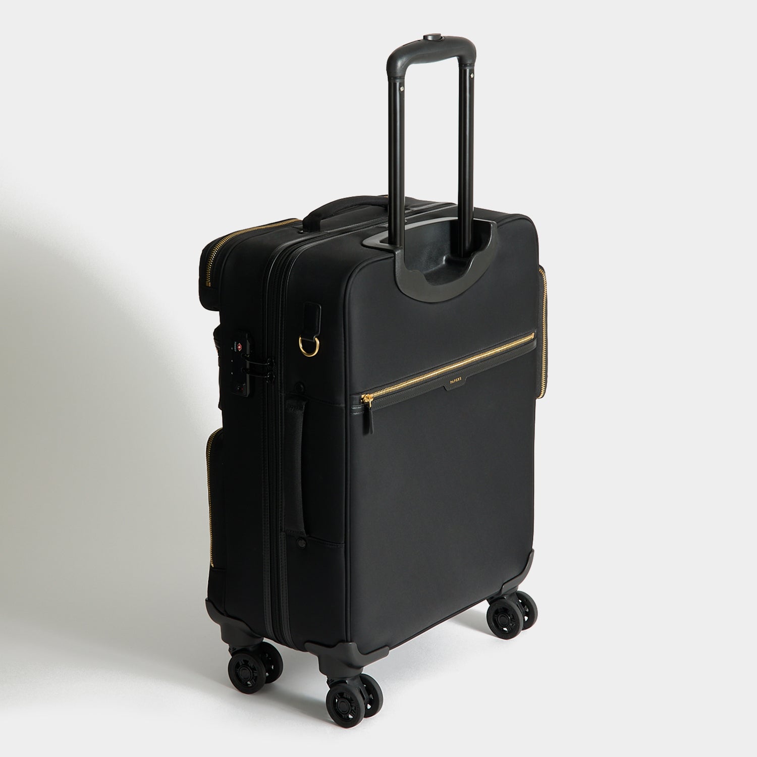 Short-Haul Suitcase -

          
            Econyl® Regenerated Nylon in Black -
          

          Anya Hindmarch UK
