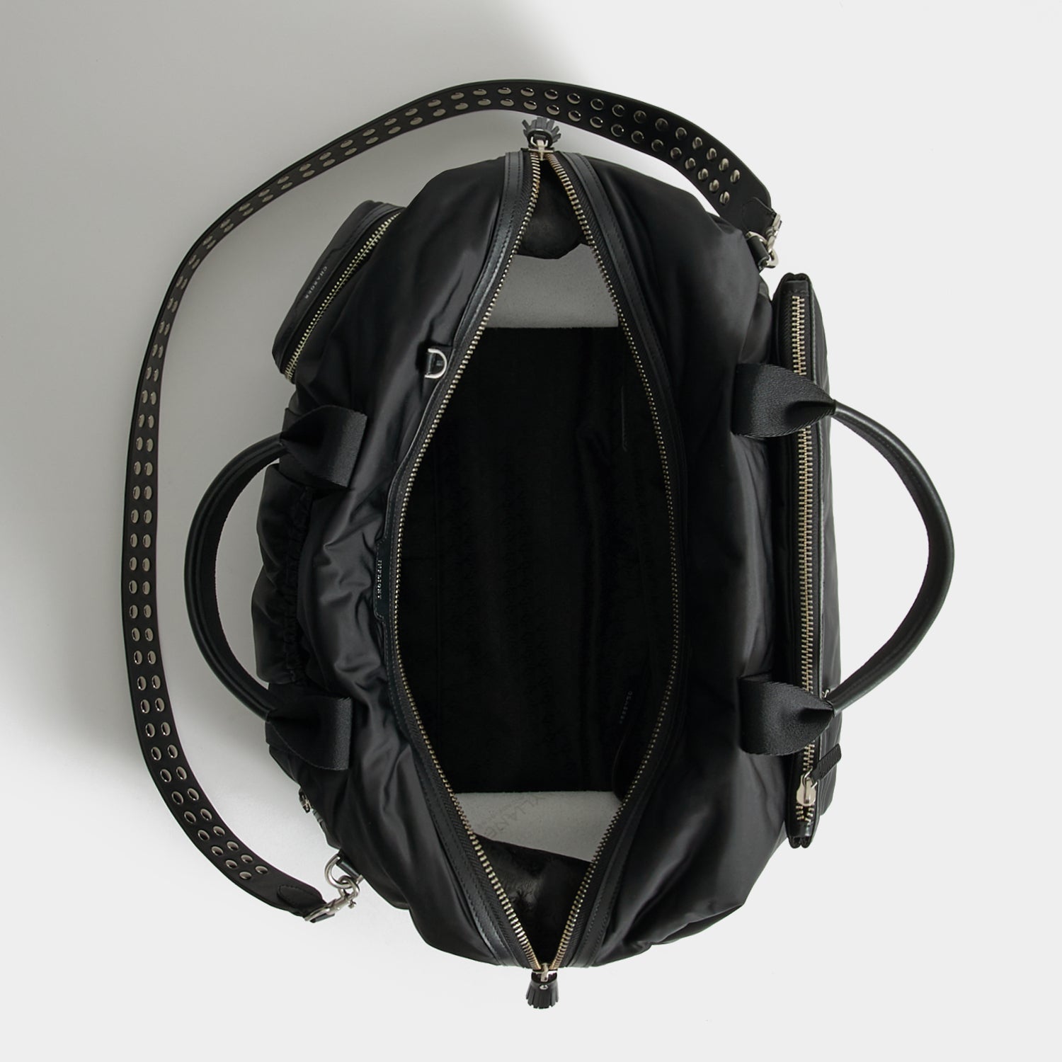 Studs In-Flight Maxi Travel Bag -

          
            Recycled Satin/Calf Leather in Black -
          

          Anya Hindmarch UK
