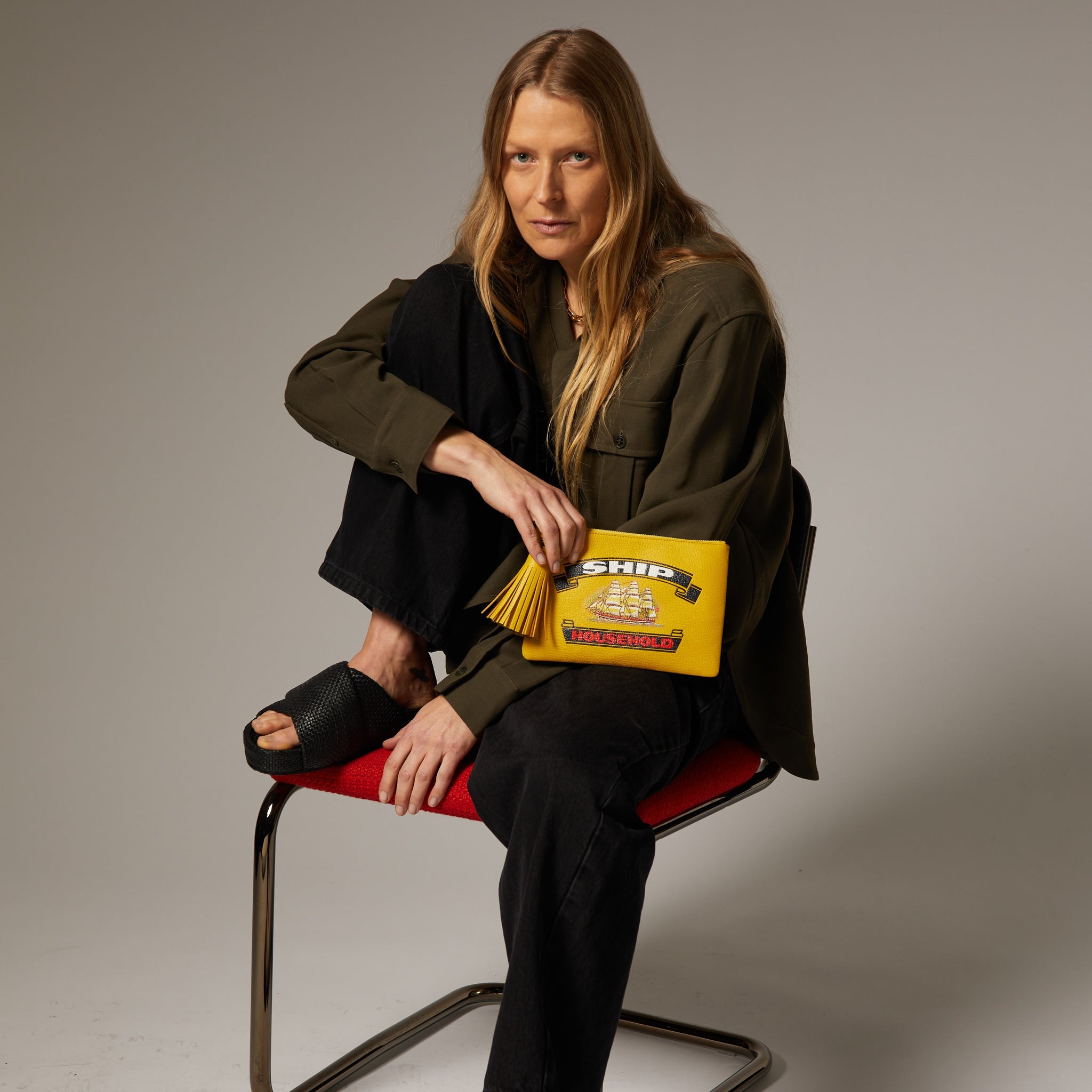 Anya Brands Ship Tassel Clutch -

                  
                    Capra Leather in Yellow -
                  

                  Anya Hindmarch UK
