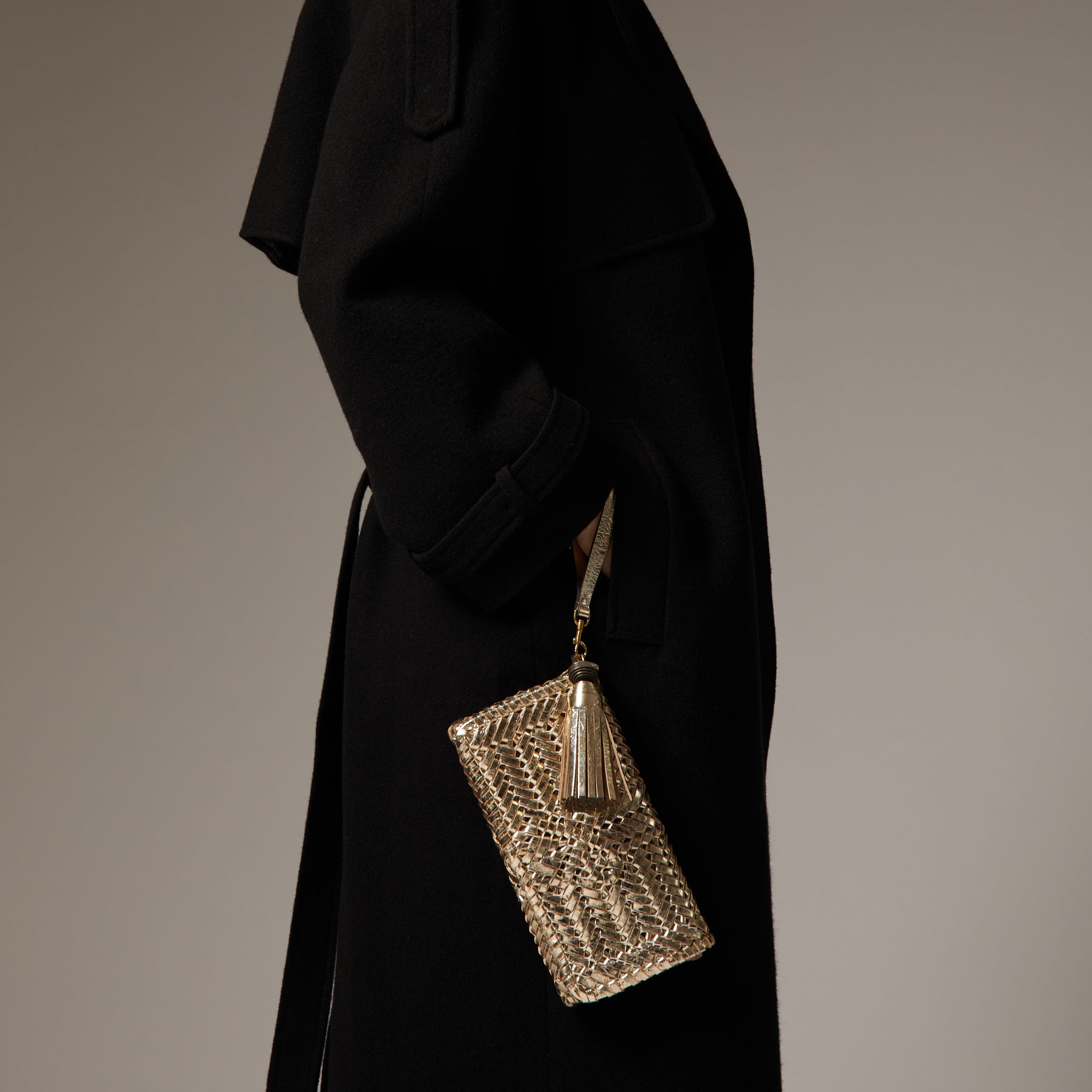Neeson Tassel Clutch -

                  
                    Capra Leather in Gold -
                  

                  Anya Hindmarch UK
