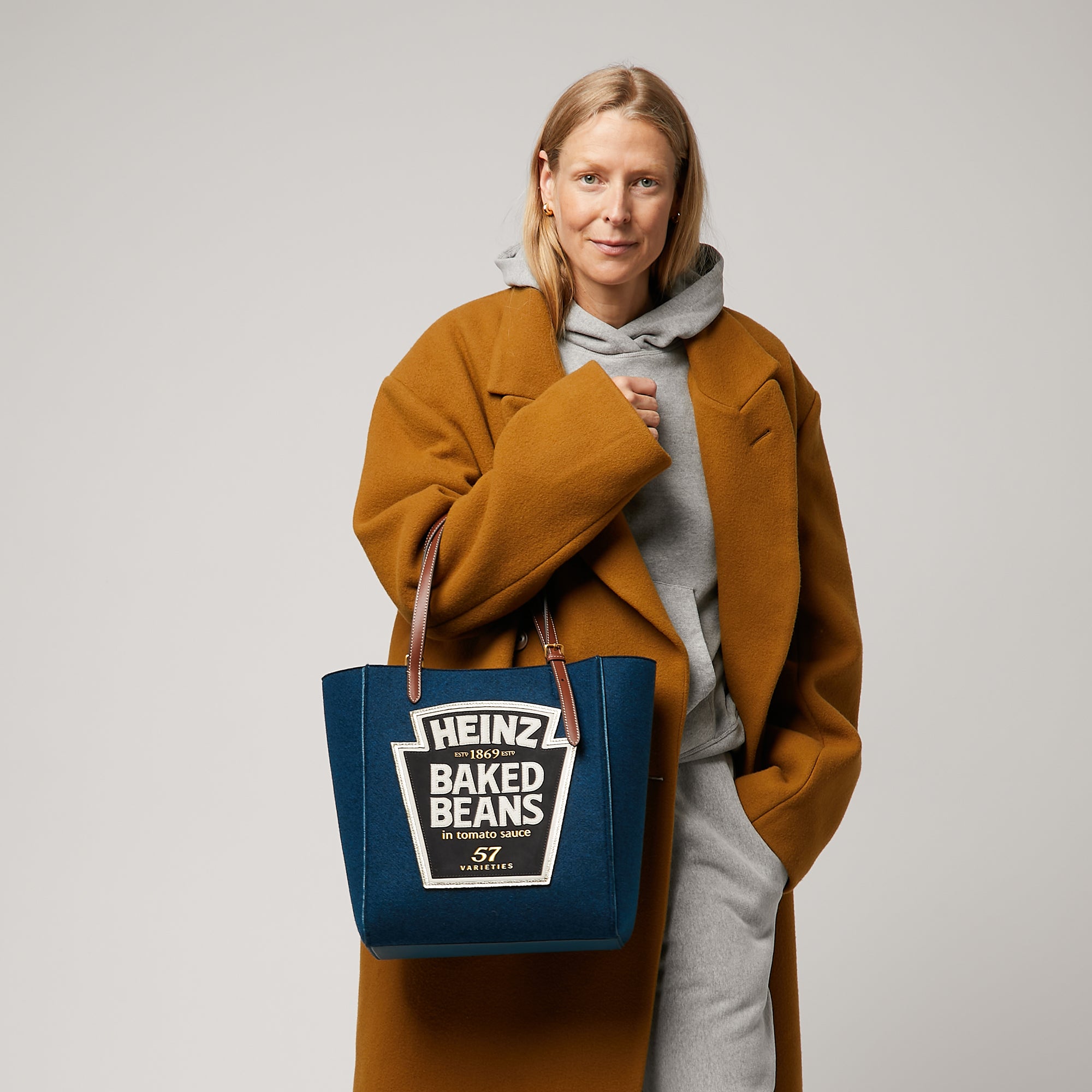 Anya Brands Heinz Baked Beans Small Tote -

                  
                    Recycled Felt in Teal -
                  

                  Anya Hindmarch UK
