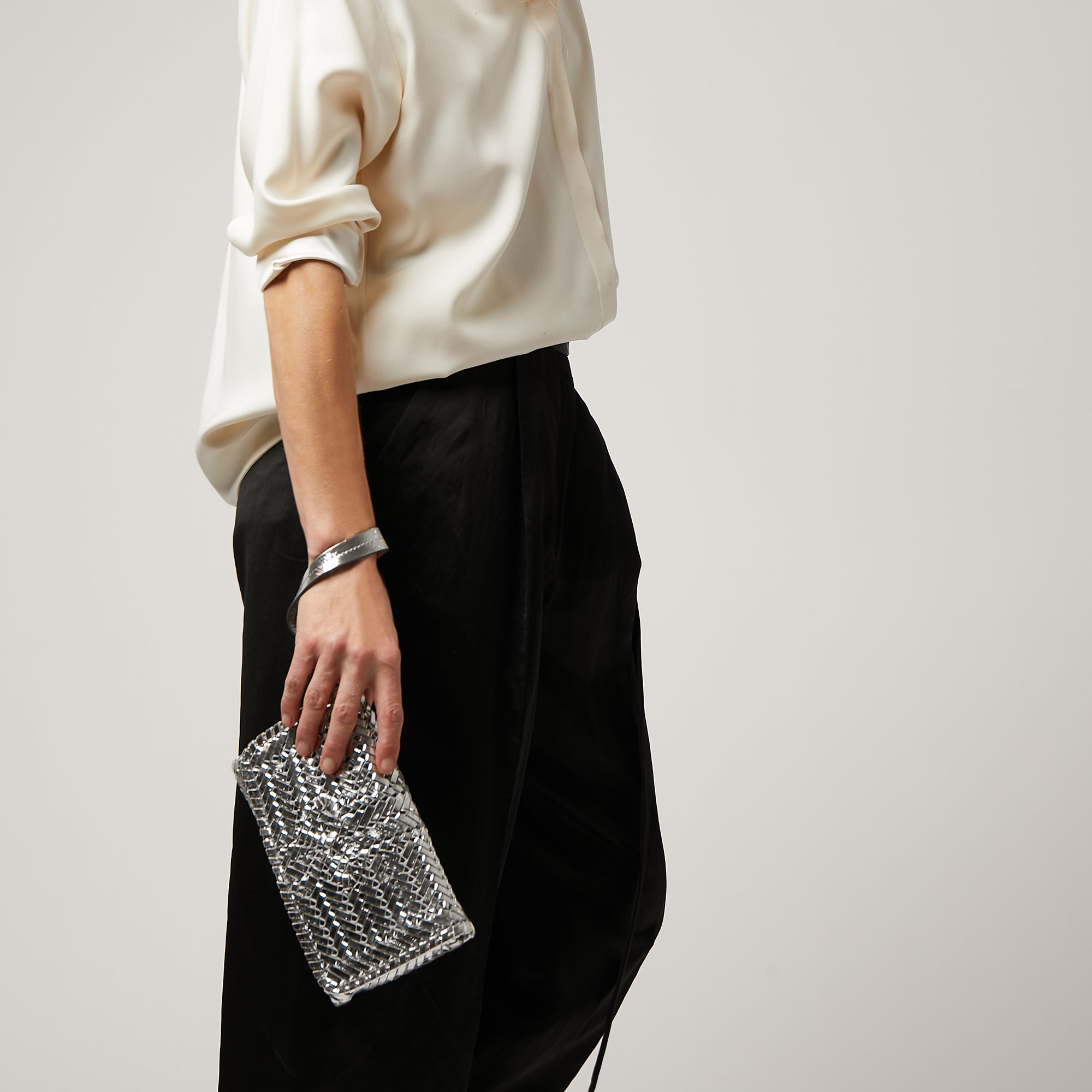 Neeson Tassel Clutch -

                  
                    Capra Leather in Silver -
                  

                  Anya Hindmarch UK
