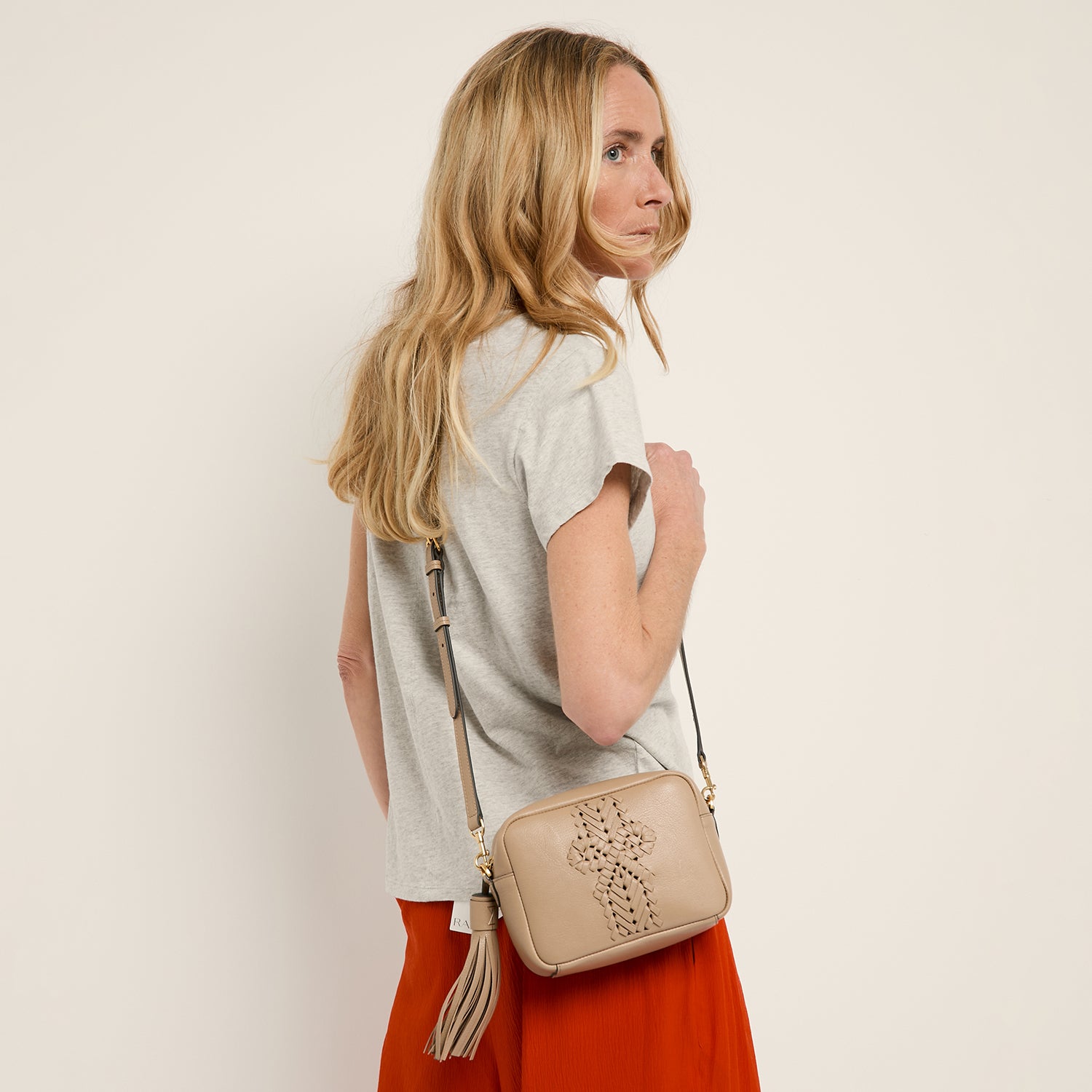 Neeson Tassel Cross-body -

                  
                    Capra Leather in Sand -
                  

                  Anya Hindmarch UK
