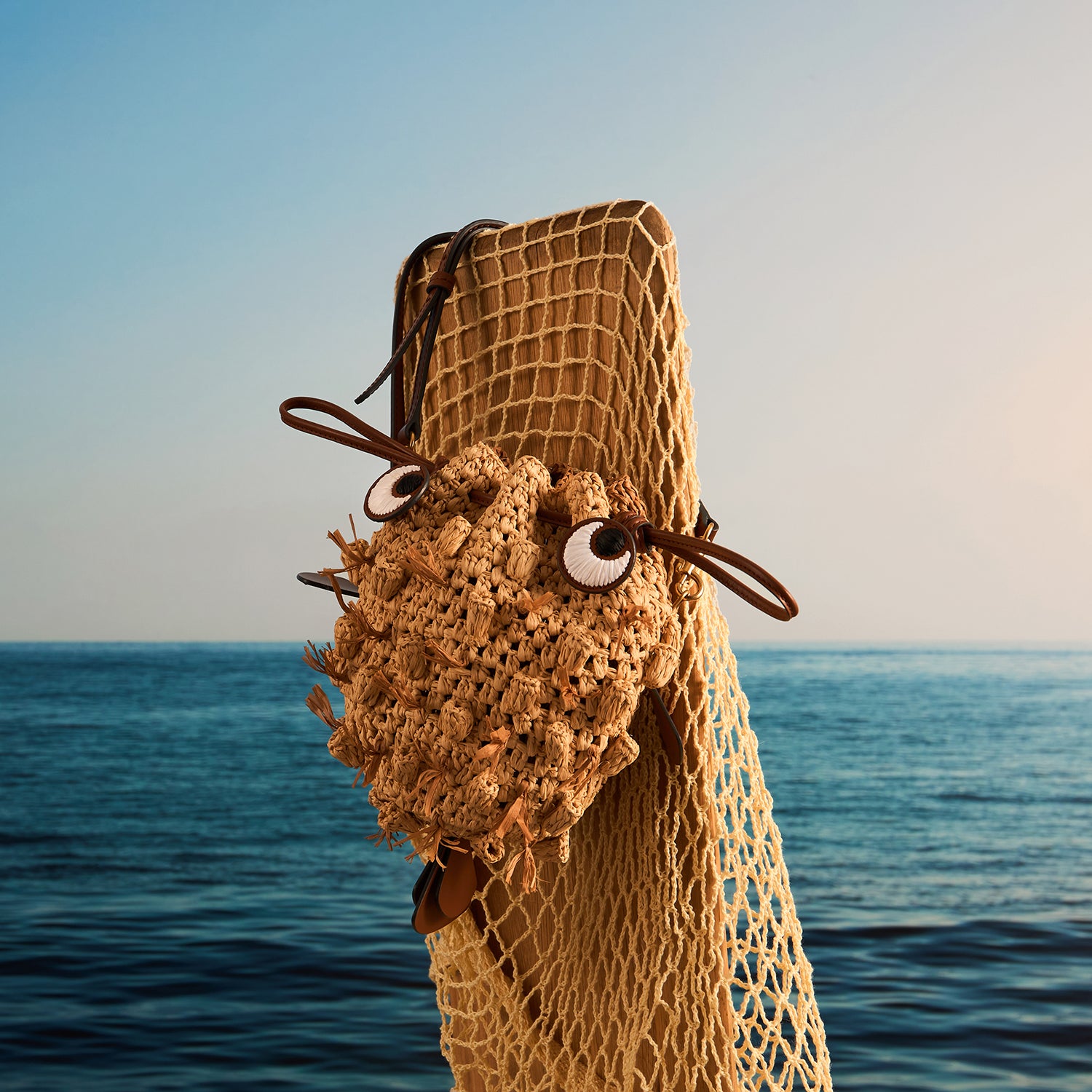 Raffia Blowfish Cross-body -

          
            Natural Raffia/Smooth Leather in Natural -
          

          Anya Hindmarch UK

