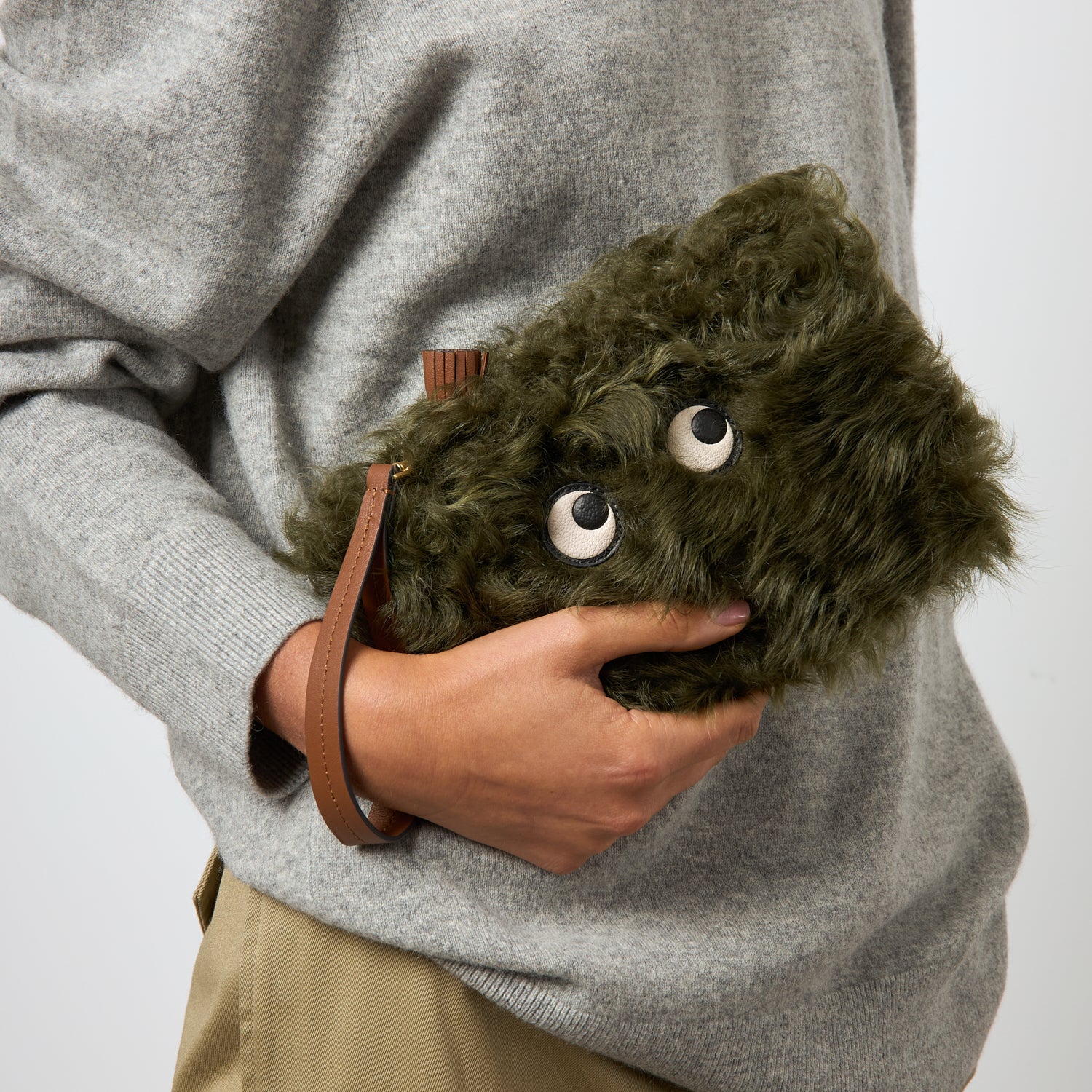 Shearling Eyes Clutch -

          
            Shearling/Smooth Leather in Khaki Green -
          

          Anya Hindmarch UK
