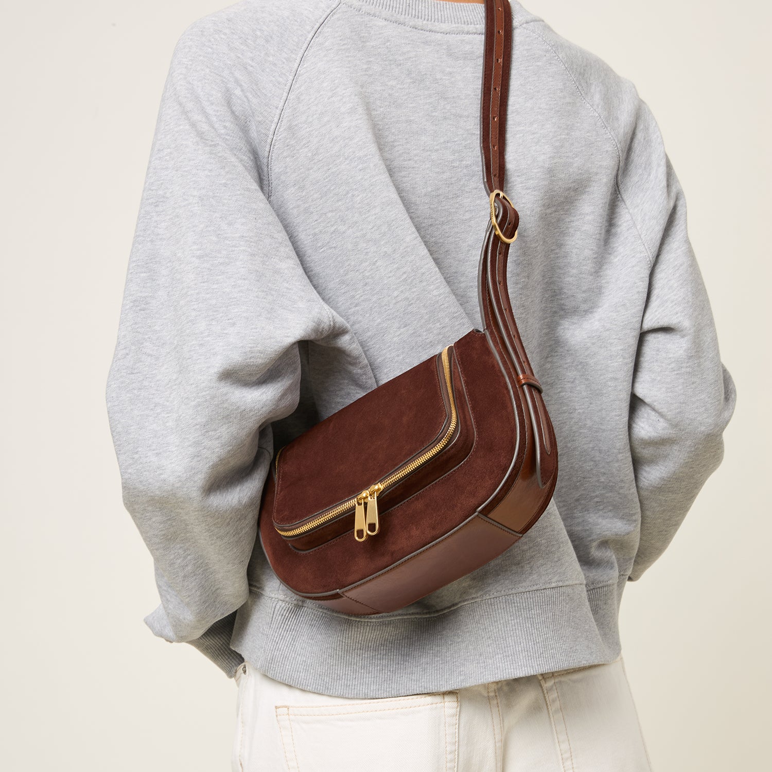 Brown suede cross-body bag by Anya Hindmarch