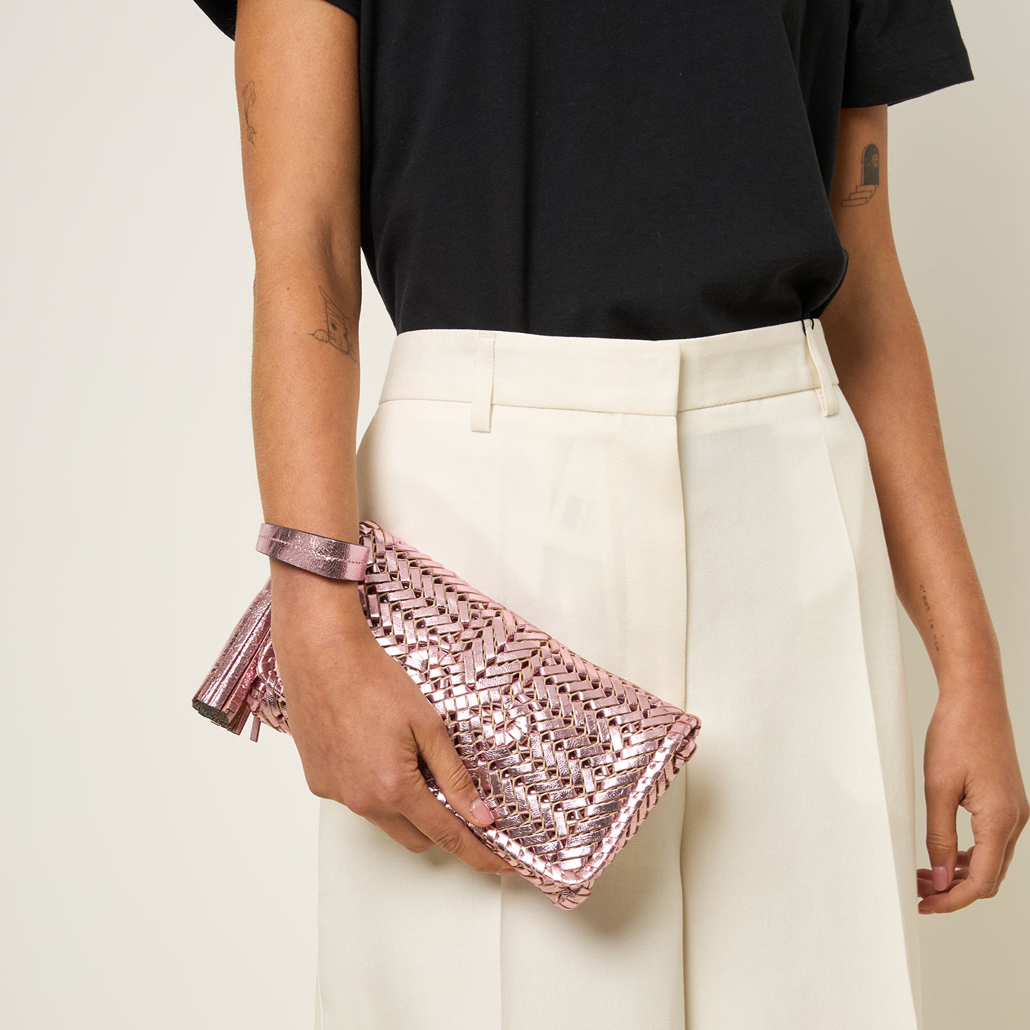 Neeson Tassel Clutch -

          
            Capra Leather in Peony Pink -
          

          Anya Hindmarch UK

