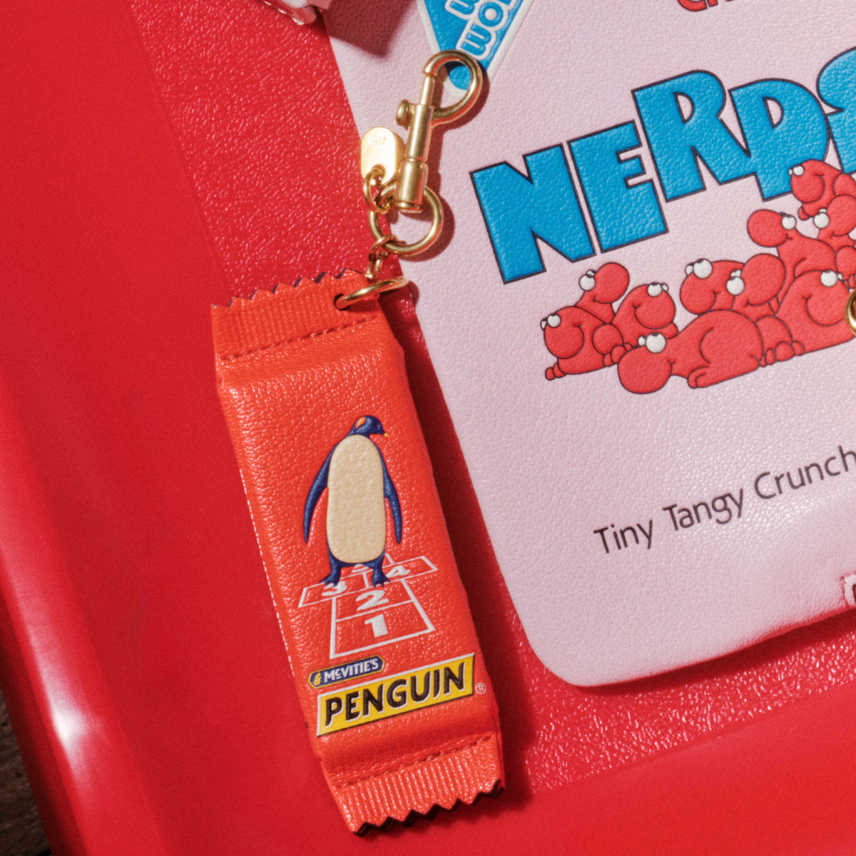 Anya Brands McVitie's Penguin Charm -

          
            Calf Leather in Flag Red -
          

          Anya Hindmarch UK
