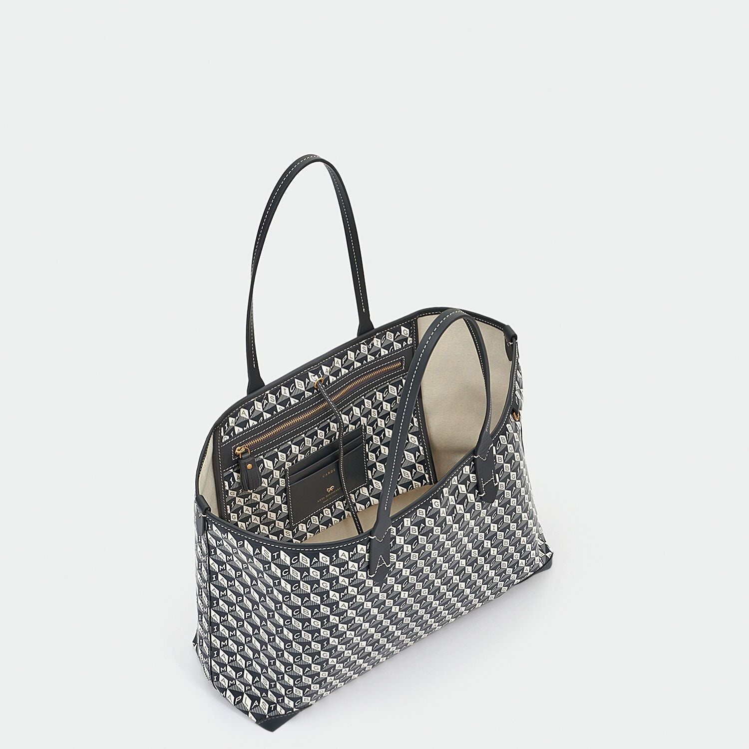 I Am A Plastic Bag Small Tote -

                  
                    Recycled Coated Canvas in Charcoal -
                  

                  Anya Hindmarch UK
