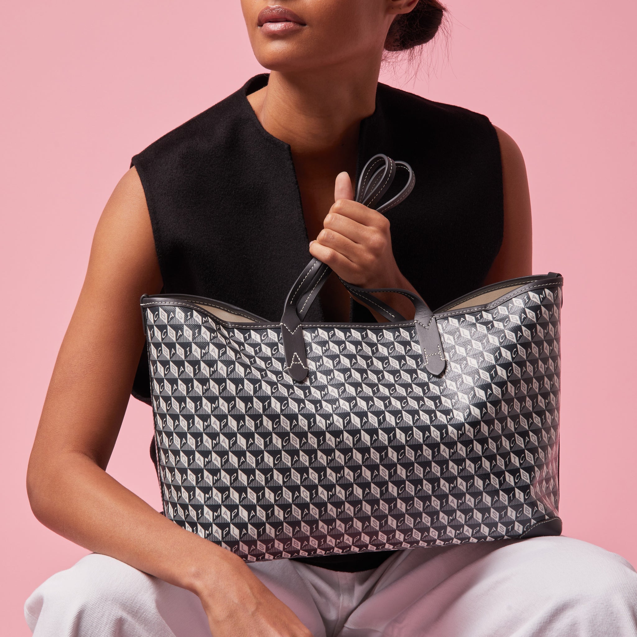 I Am A Plastic Bag Small Tote -

                  
                    Recycled Coated Canvas in Charcoal -
                  

                  Anya Hindmarch UK
