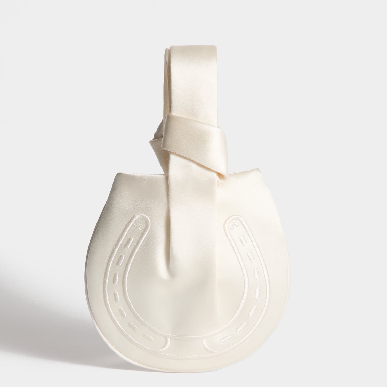 Tie the Knot Clutch -

          
            Double Satin in Ivory -
          

          Anya Hindmarch UK
