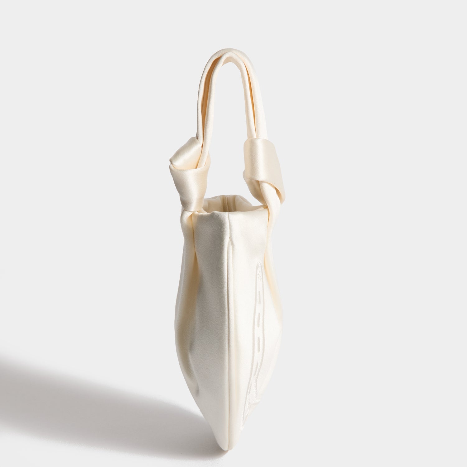Tie the Knot Clutch -

          
            Double Satin in Ivory -
          

          Anya Hindmarch UK
