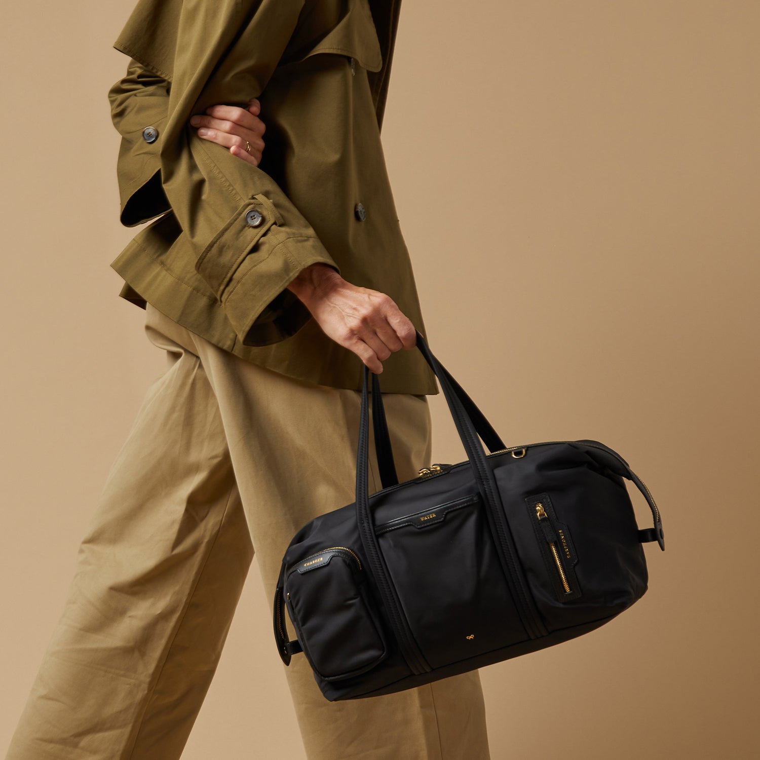 In-Flight Travel Bag -

          
            Regenerated Econyl® in Black -
          

          Anya Hindmarch UK
