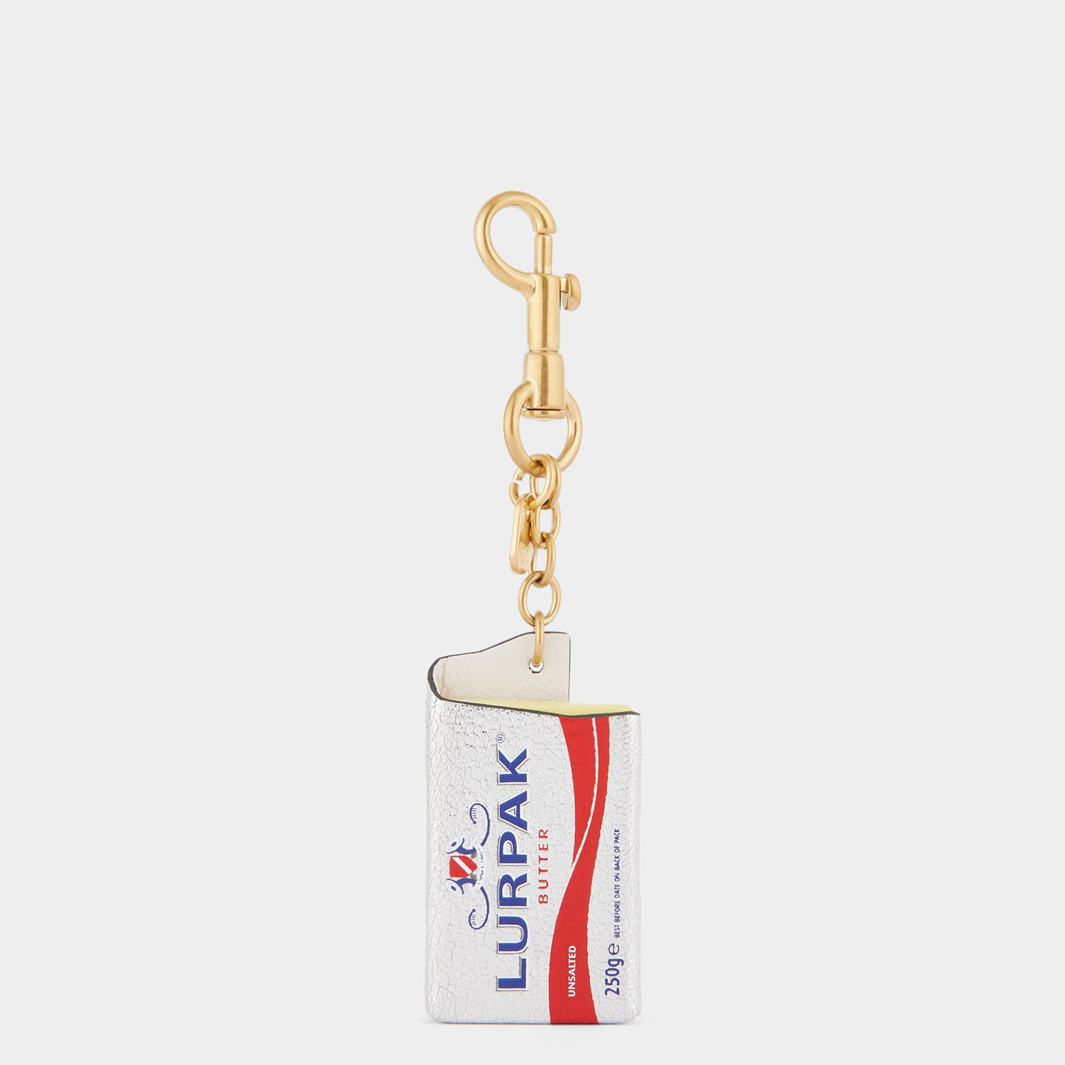 Anya Brands Lurpak Charm -

                  
                    Capra Leather in Silver -
                  

                  Anya Hindmarch UK
