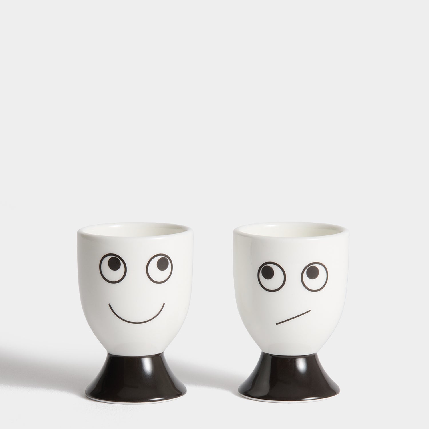 Eyes Egg Cup Set -

          
            Bone China in White -
          

          Anya Hindmarch UK
