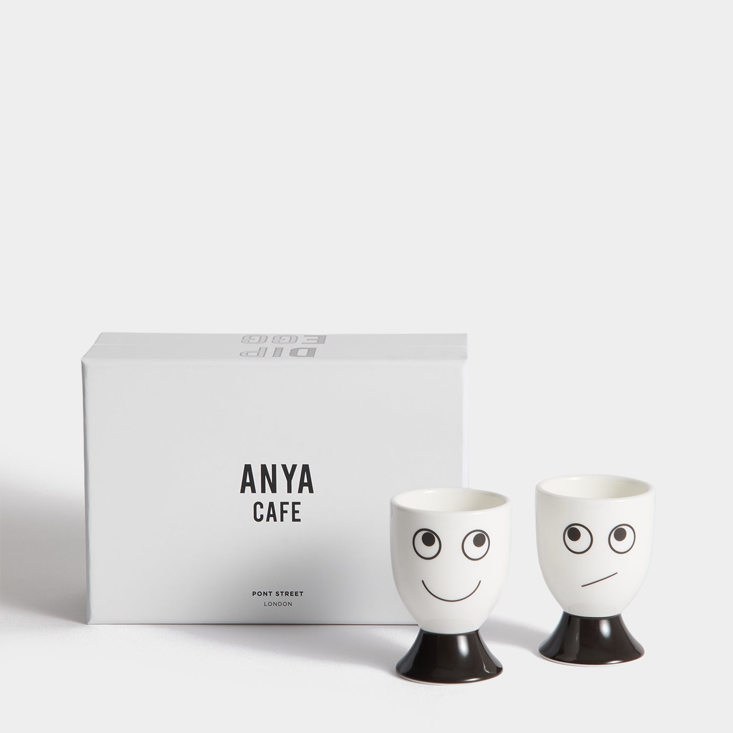 Eyes Egg Cup Set -

          
            Bone China in White -
          

          Anya Hindmarch UK
