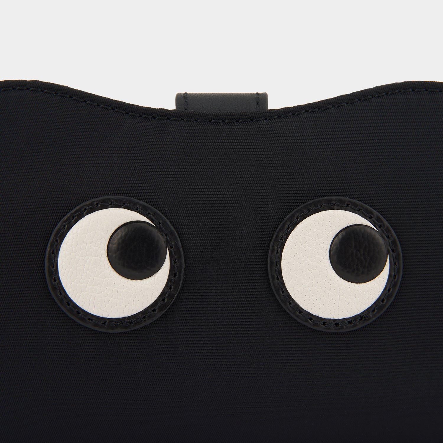 Eyes Sunglasses Holder -

                  
                    Econyl® Regenerated Nylon in Black -
                  

                  Anya Hindmarch UK
