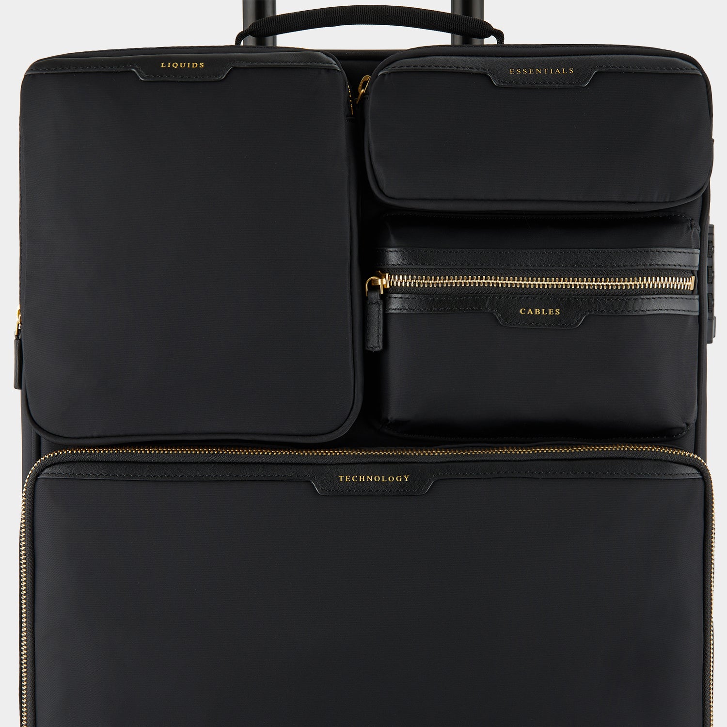 Short-Haul Suitcase -

                  
                    Econyl® Regenerated Nylon in Black -
                  

                  Anya Hindmarch UK

